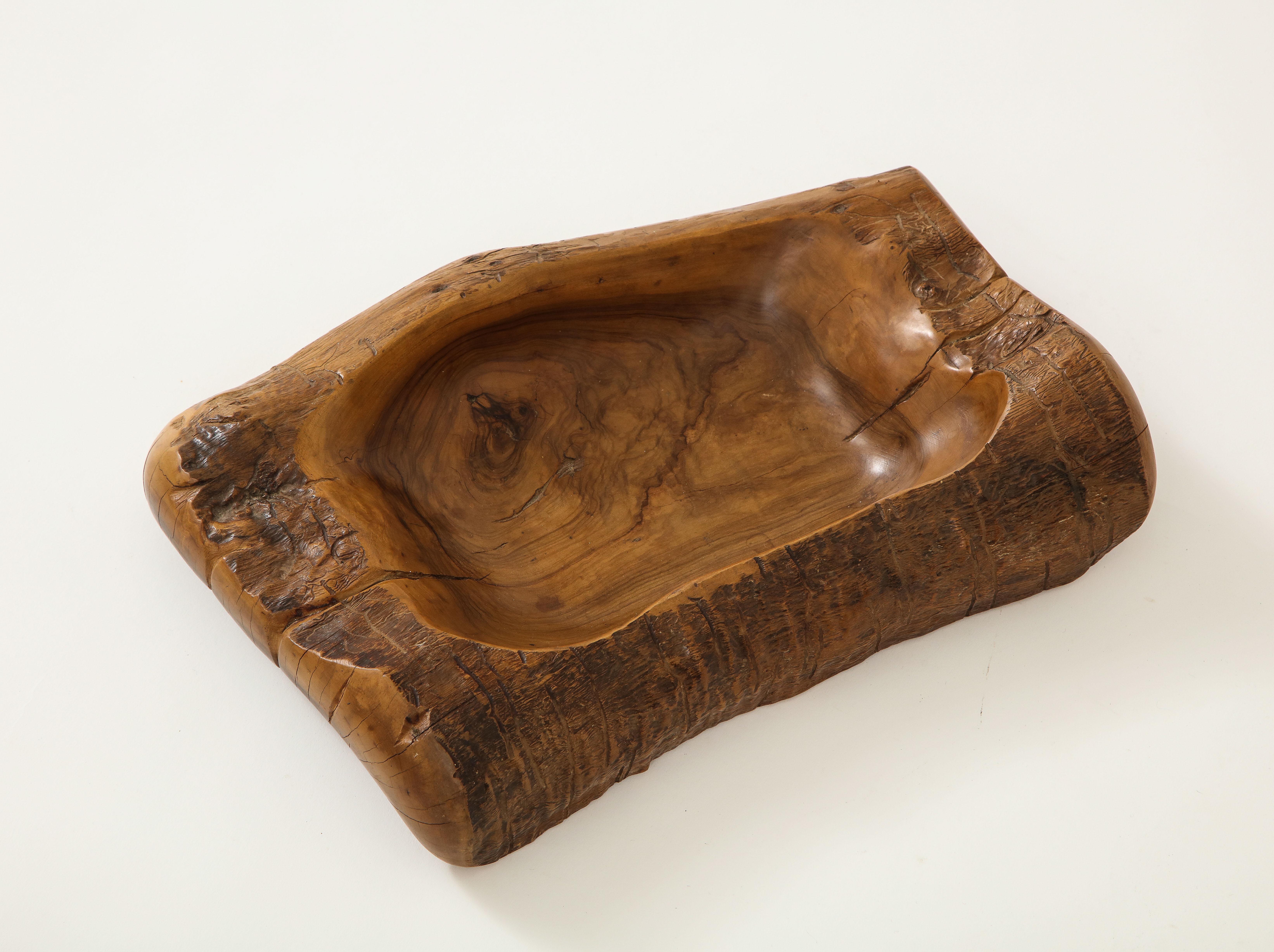 Classic Olivewood Videpoche by Alexandre Noll, France, c. 1950 (Signed) 

This object is a trademark example of Noll's exquisite artistry and powerful sensitivity to the medium of wood. The videpoche consists of a wonderfully sculpted border with