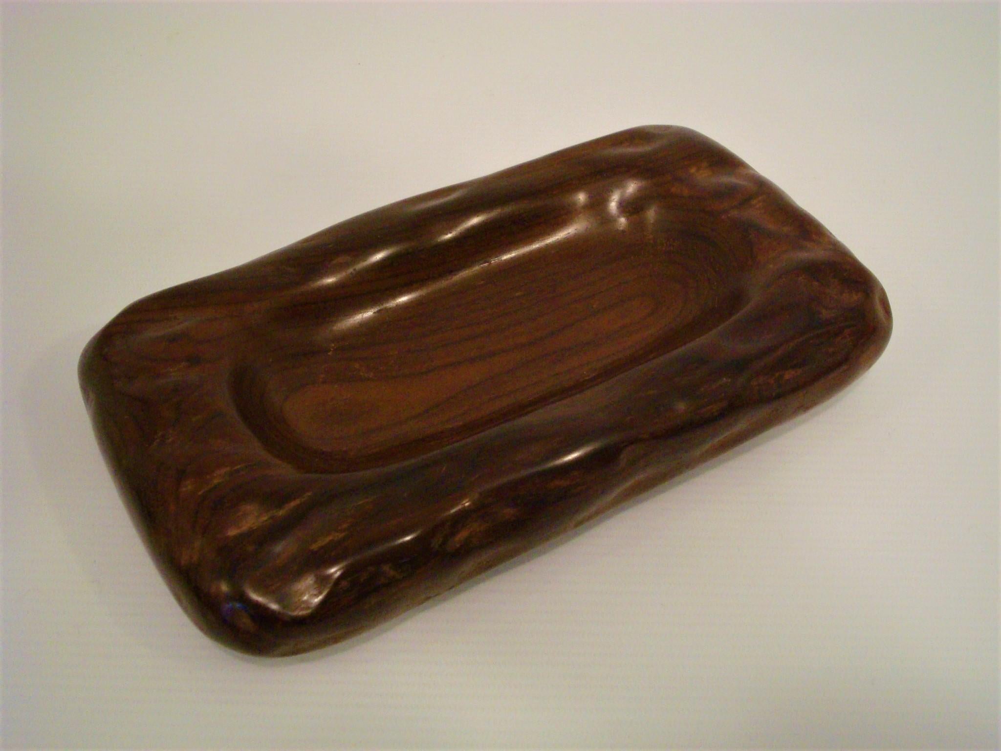 Lovely Alexandre Noll cigar ashtray / bowl / Dish. Carved in exotic wood.
Alexandre Noll hand carved Cigar Ashtray.
Mid-century. 
France, c. 1950
Hand carved signature to underside 'ANoll'.
Example shows minor surface wear to underside