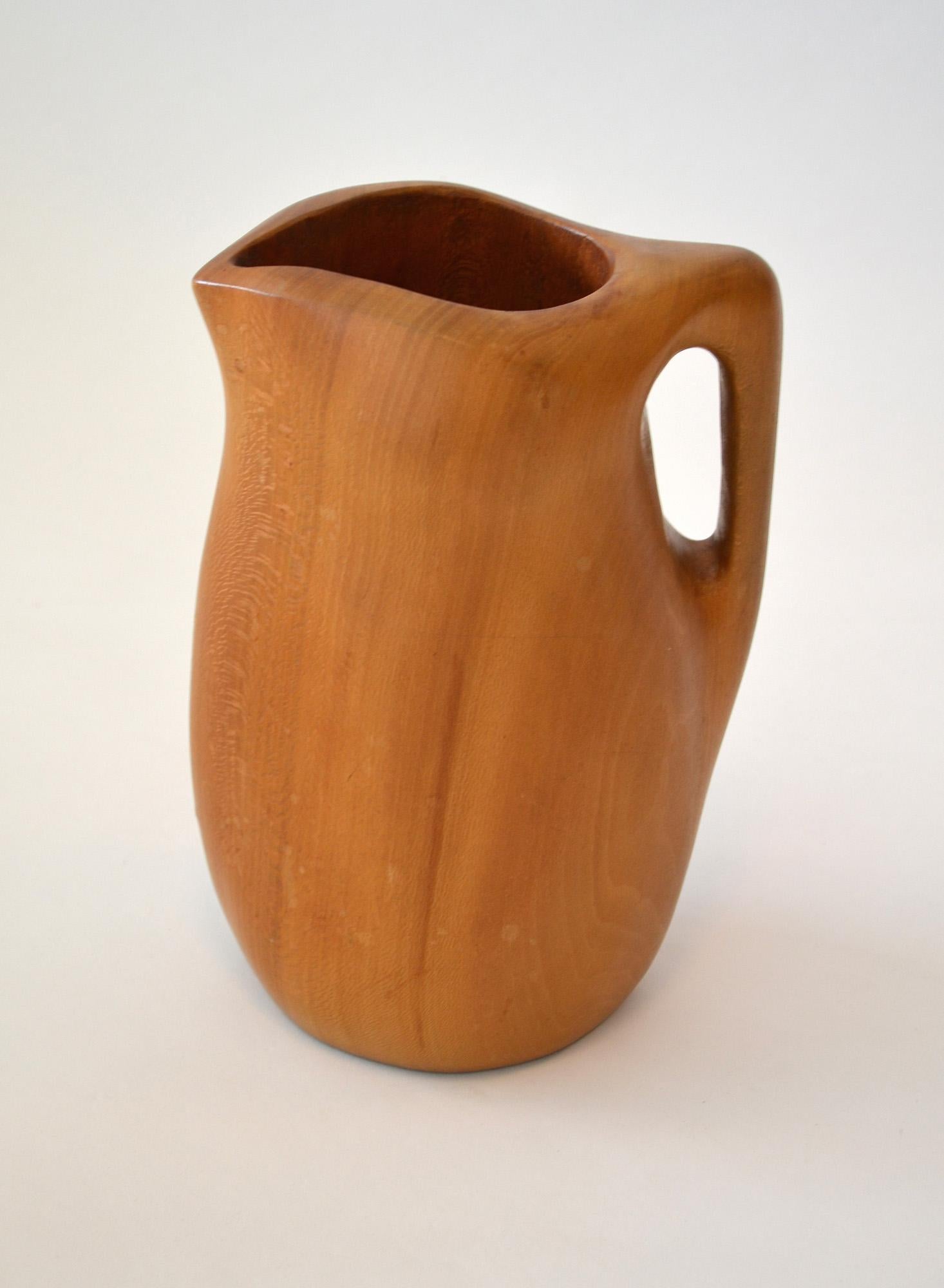 Alexandre Noll Pitcher in Carved Sycamore France c. 1950 

Acquired from the estate of a former Saks Fifth Avenue Executive. This rare piece was presented by Noll as a sample to Saks marketing department c. 1950.

Beautiful natural organic form, in