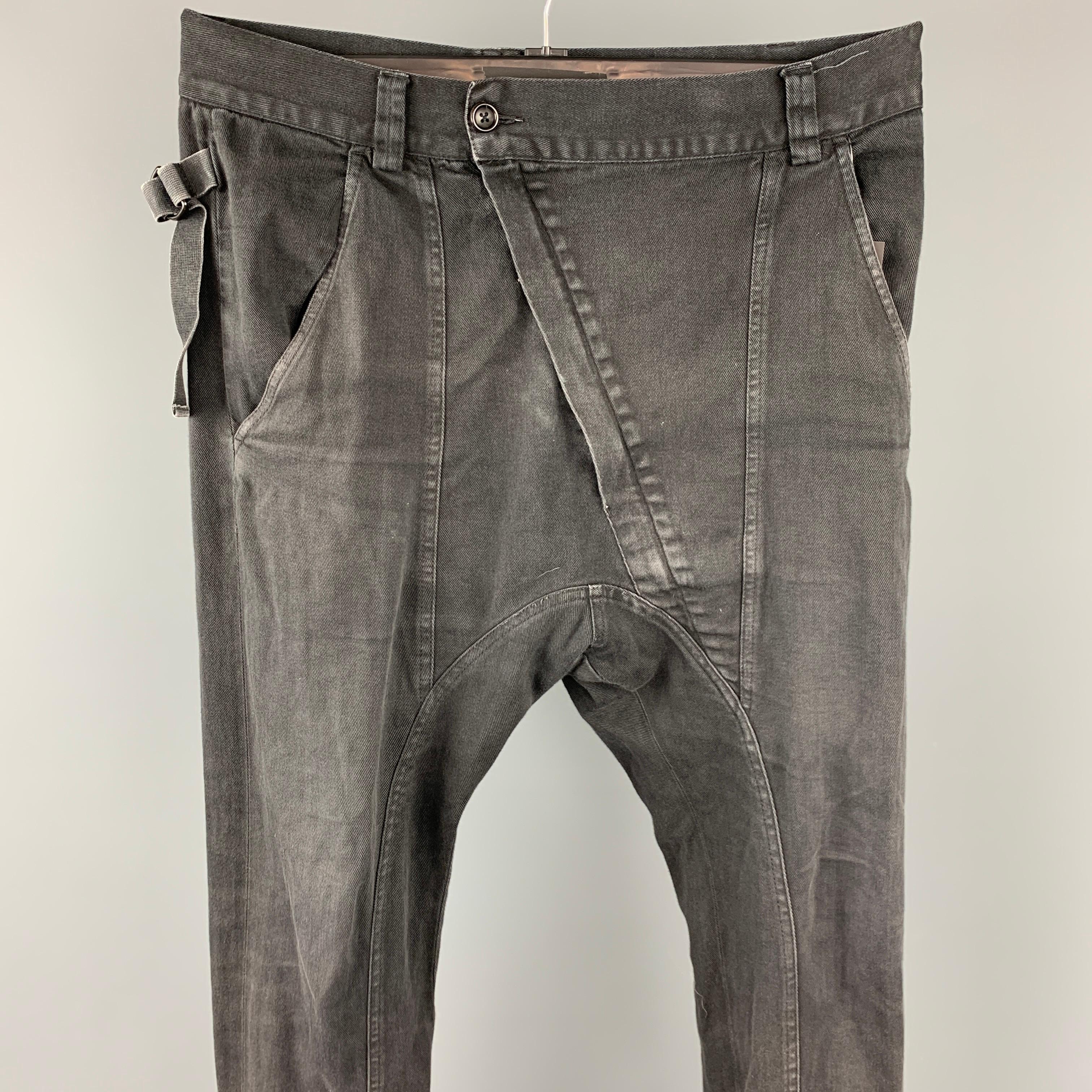 ALEXANDRE PLOKHOV casual pants comes in a black cotton featuring a drop-crotch style, adjustable back straps, and a diagonal zip up closure. Made in Italy.

Good Pre-Owned Condition.
Marked: 46

Measurements:

Waist: 34 in.
Rise: 16 in.
Inseam: 31