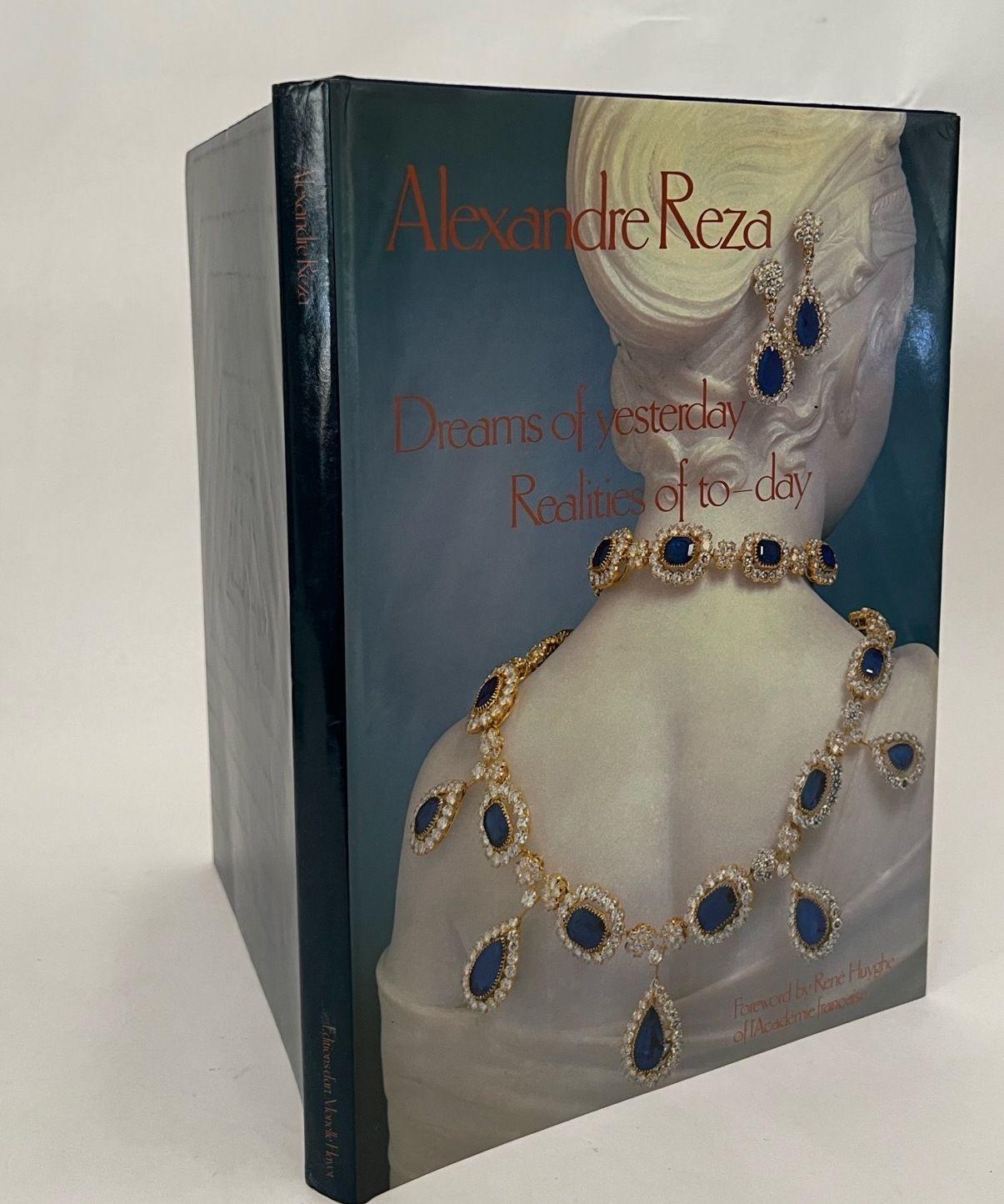 Alexandre Reza: Dreams of Yesterday Realities of To-day is a book about the life and work of Alexandre Reza, a Paris-based jeweler known for his diverse and rare collection of precious gemstones.
Large hardcover coffee table book written by Arlette