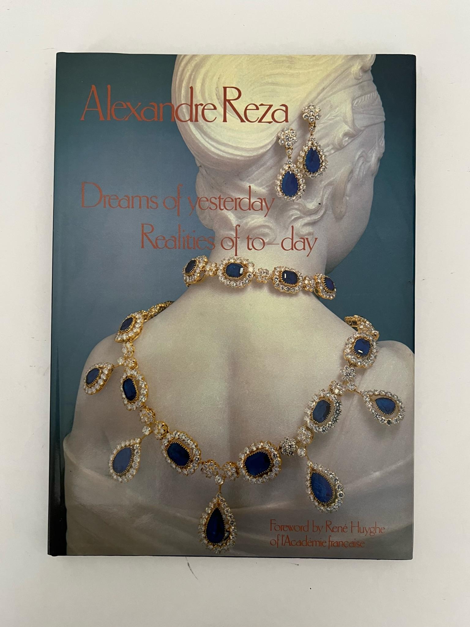 Alexandre Reza: Dreams of Yesterday Realities of To-day is a book about the life and work of Alexandre Reza, a Paris-based jeweler known for his diverse and rare collection of precious gemstones.
Large hardcover coffee table book written by Arlette