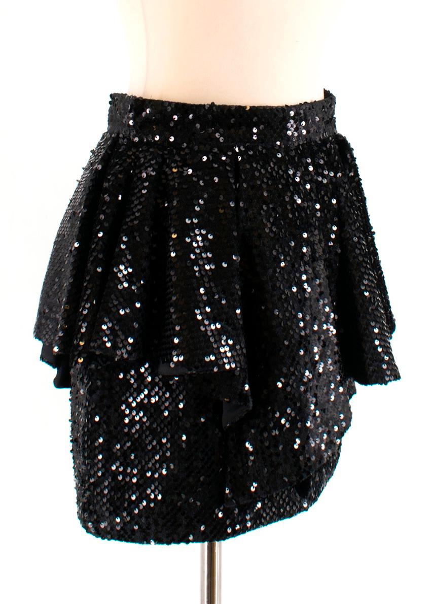 Alexandre Vauthier - Black Sequin ruffle mini skirt

- Ruffled overlay - sequin embellishment - zip up fastening at the back

Please note, these items are pre-owned and may show signs of being stored even when unworn and unused. This is reflected