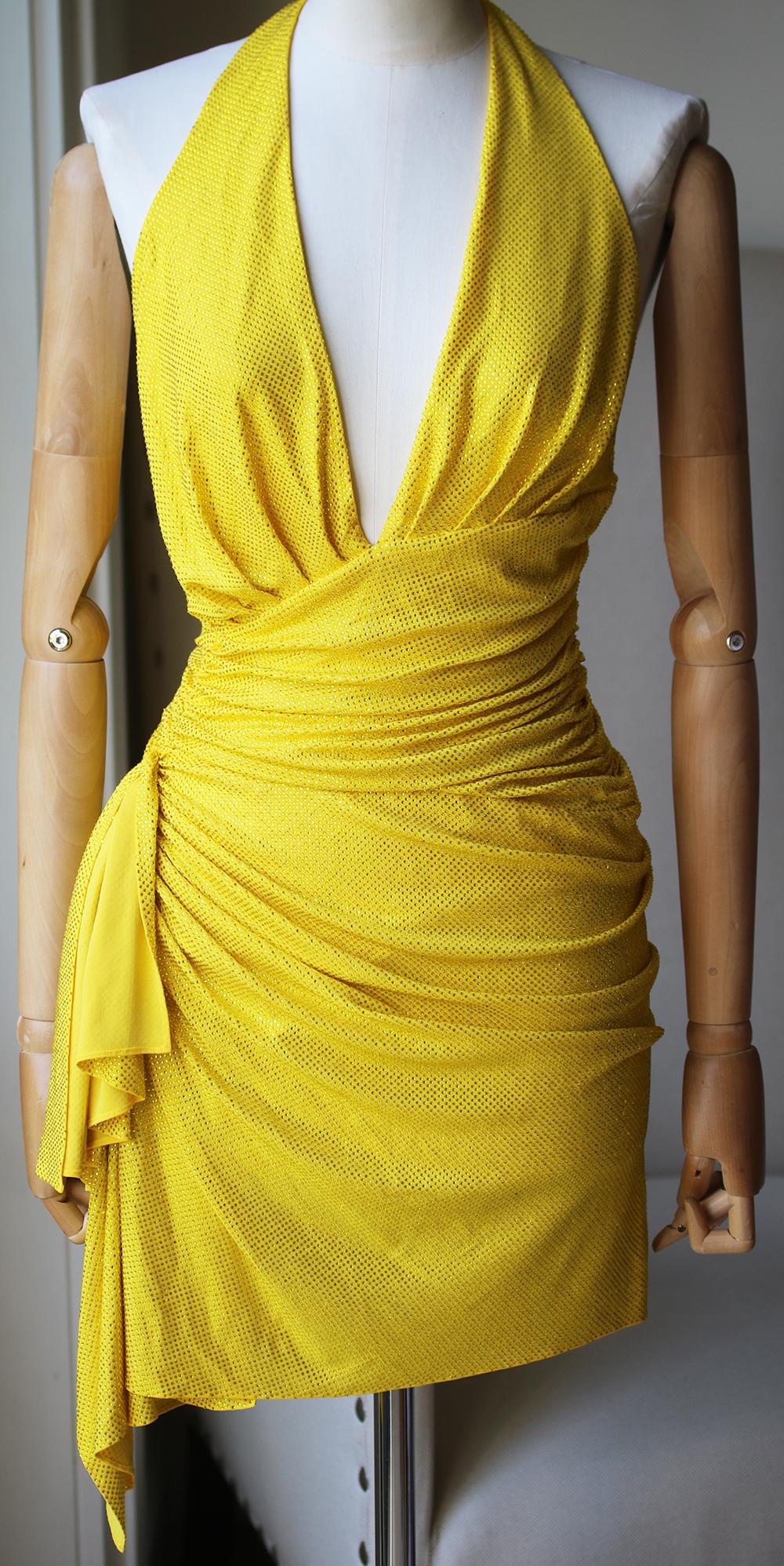 Crossover neckline. Microcrystal embellished accents throughout. Ruched side detail with draped fabric accent. Fully lined. Colour: yellow. Made in Italy. 92% viscose, 8% elastane. 

Size: IT 38 (UK 6, US 2, FR 34)

Condition: As new condition, no