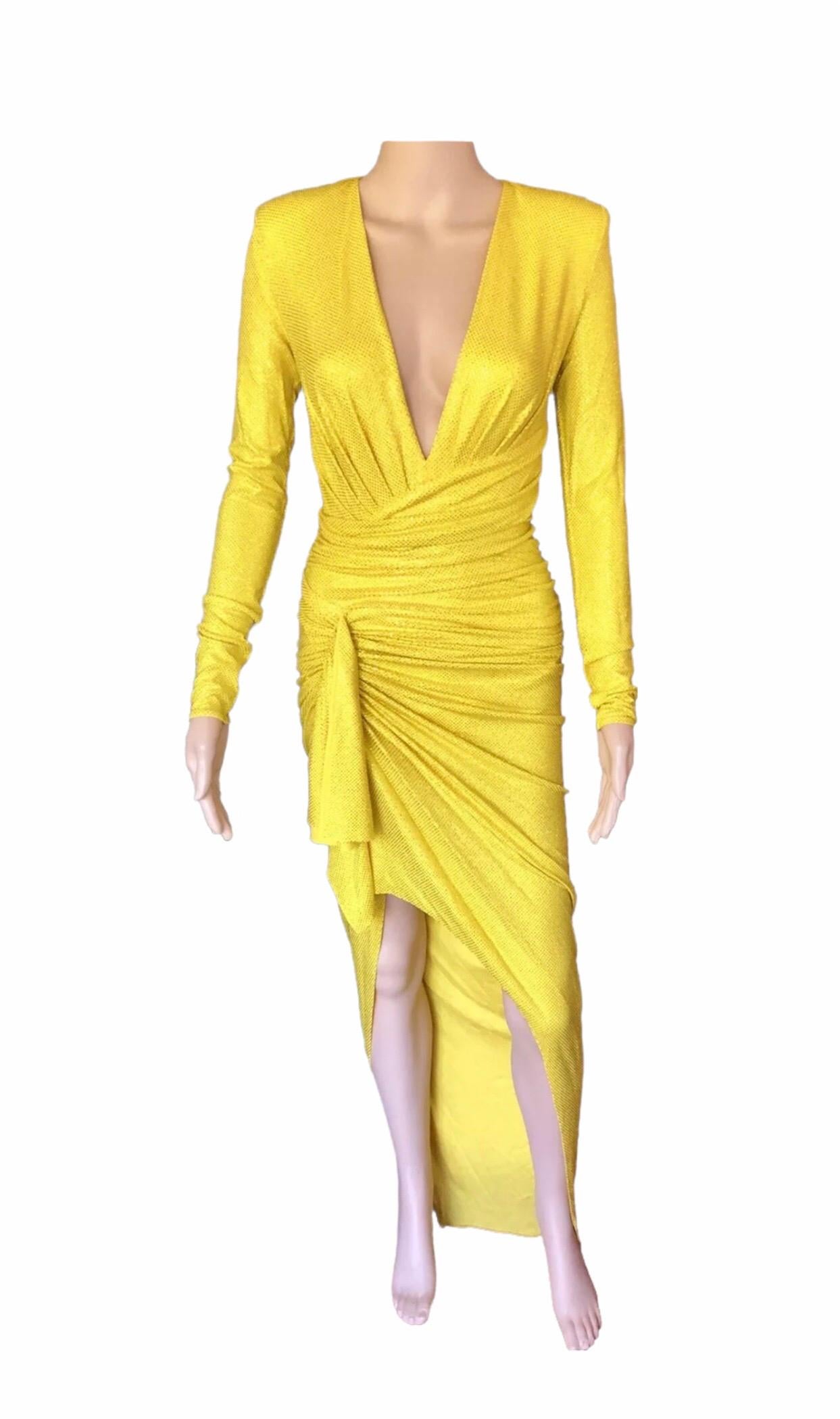 Alexandre Vauthier Crystal Embellished Plunging Neckline Yellow Evening Dress Gown FR 36

• Made in Italy

• Dry clean only

• Crossover neckline

• Microcrystal embellished accents throughout

• Ruched side detail with draped fabric accent

