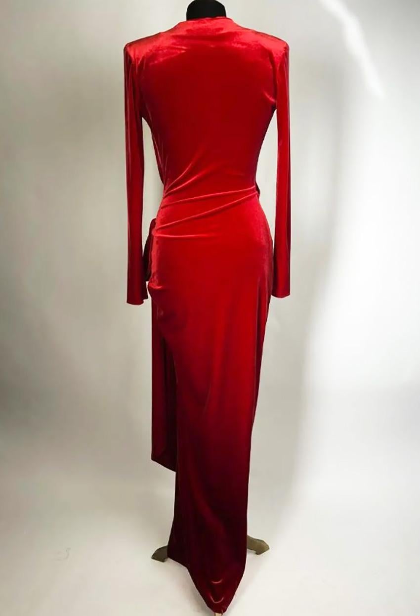 ALEXANDRE VAUTHIER

This gown by Alexandre Vauthier is cut from soft stretch-velvet and has a knotted, draped front that falls to an floor length, it has a plunging neckline and structured shoulders giving you that extra confidence.
 Red velvet.
