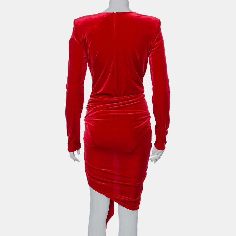 Creations from Alexandre Vauthier make sure to never go unnoticed whenever they're worn by a diva like you! This ravishing red velvet mini dress is absolutely stunning. From the faux wrap flattering silhouette to the plunging neckline and the long