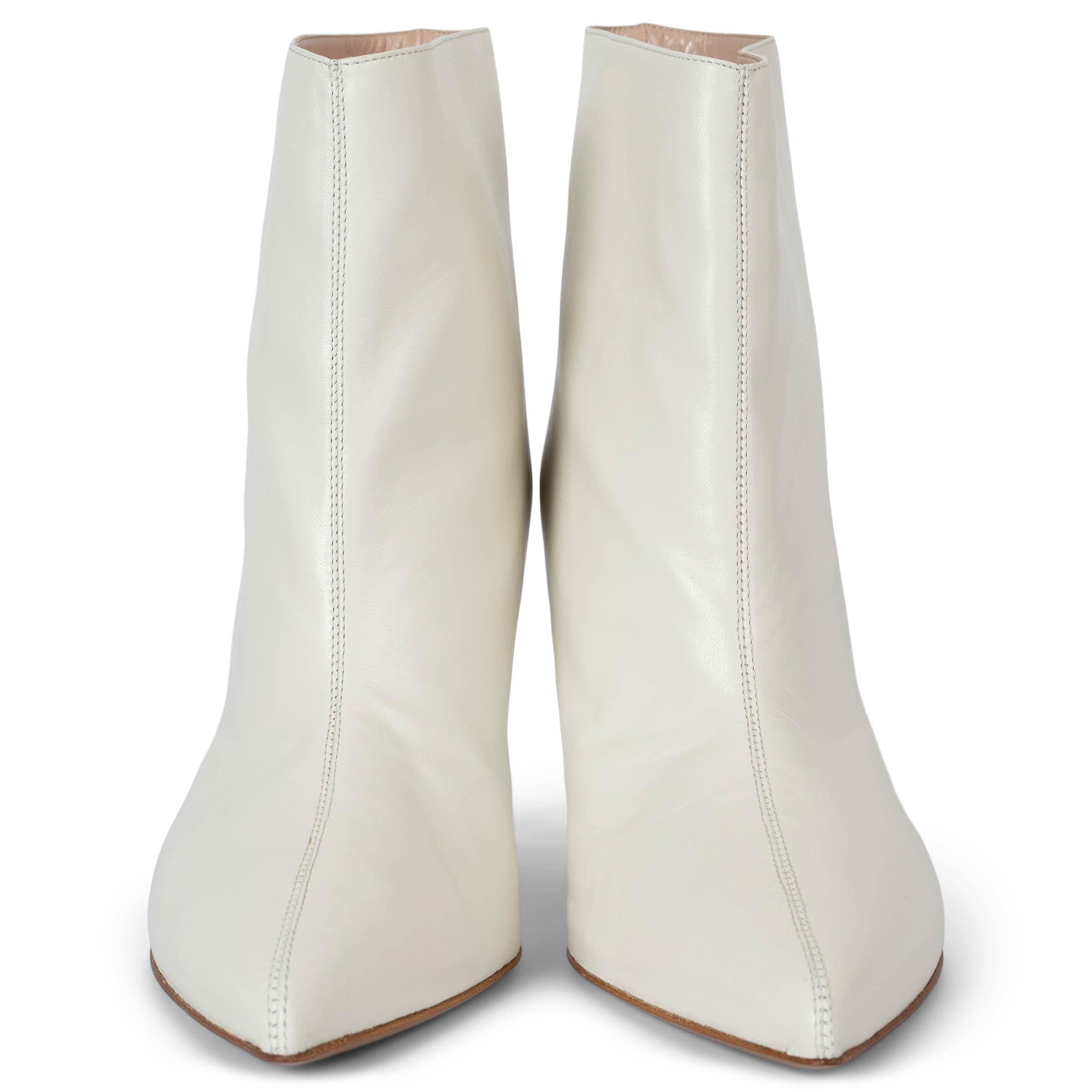 These 100% authentic Alexandre Vauthier Alex ankle boots in white leather exude cool, sexy sophistication. Featuring a bold large top opening, sleek pointed toes, and daring stiletto heels, these boots are the ultimate statement piece for turning
