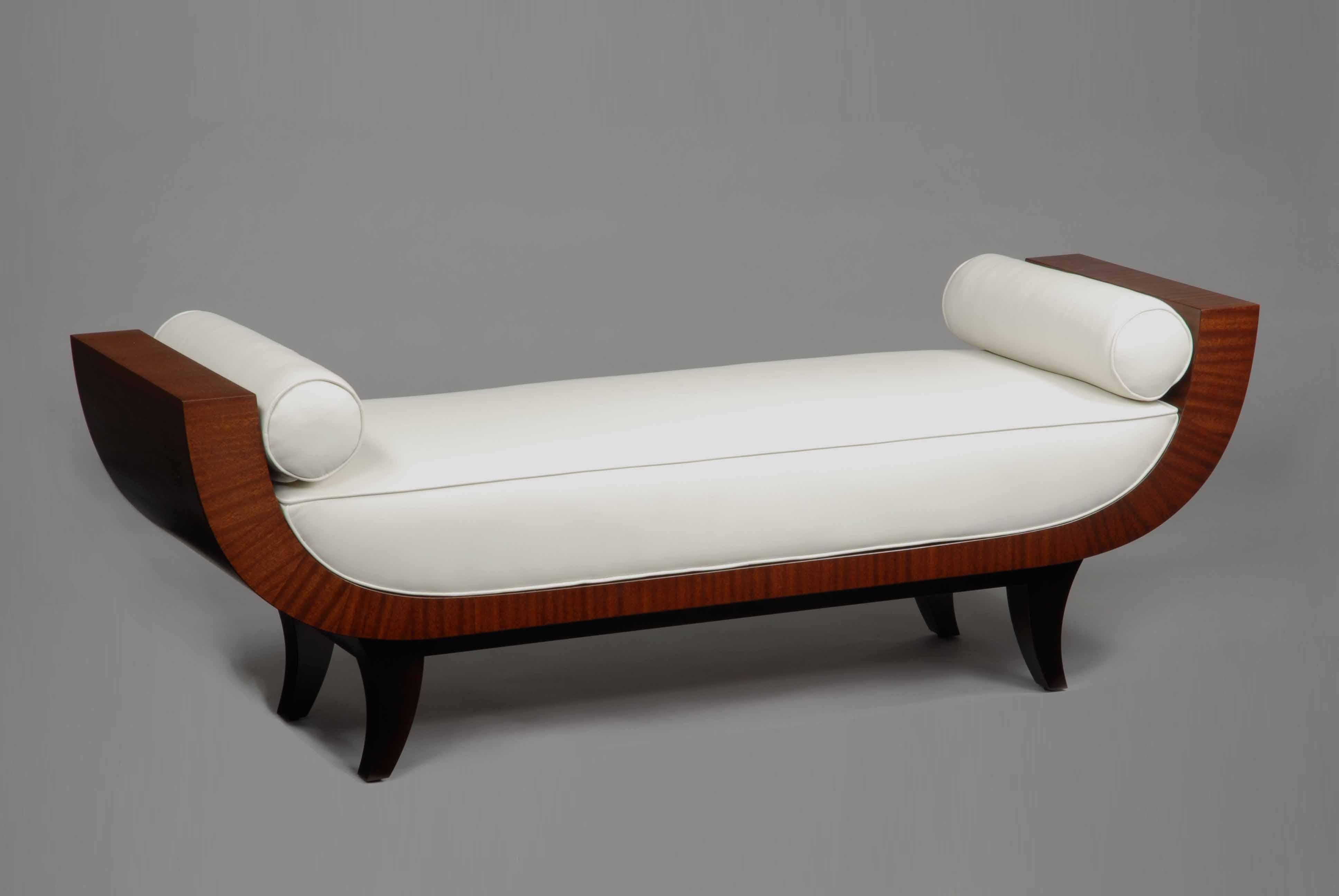 espresso maple legs and chestnut ribbon sapeli frame, and cream color leather.
Available in any fabric or leather.

All our work is original, signed, dated, and made to order on a custom basis. This allows for choices of materials, dimensions and