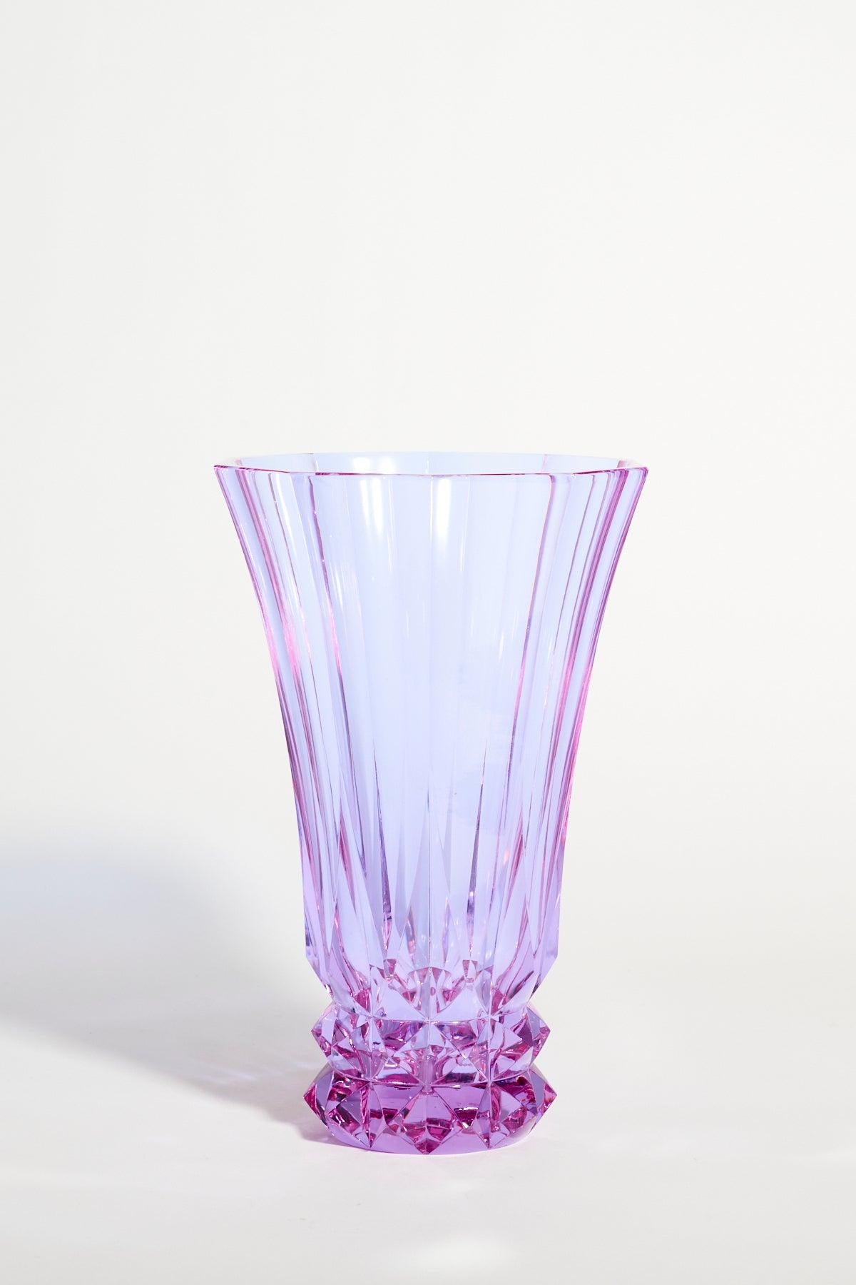 Heavy Alexandrite glass vase with fluted body and deeply cut geometric pattern to the base, showing colors of pink, lilac and blue according to the light source.