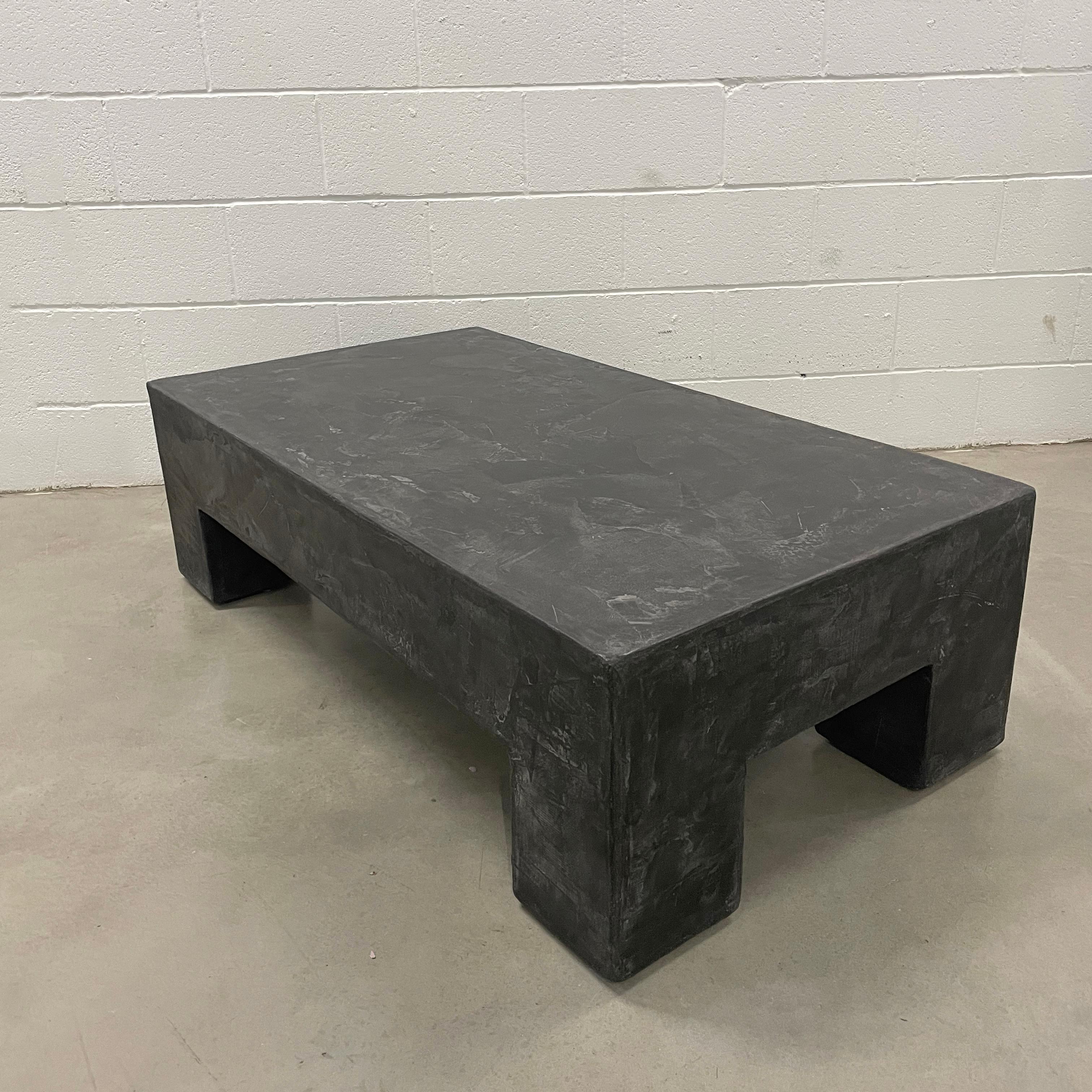 Coffee table 
Artist Alexey Krupinin

Its simple geometric shape has a durable finish and is made of wood with multiple layers of hand-trowelled Venetian plaster, creating unique silhouettes from different angles. Tooling marks and surface scratches