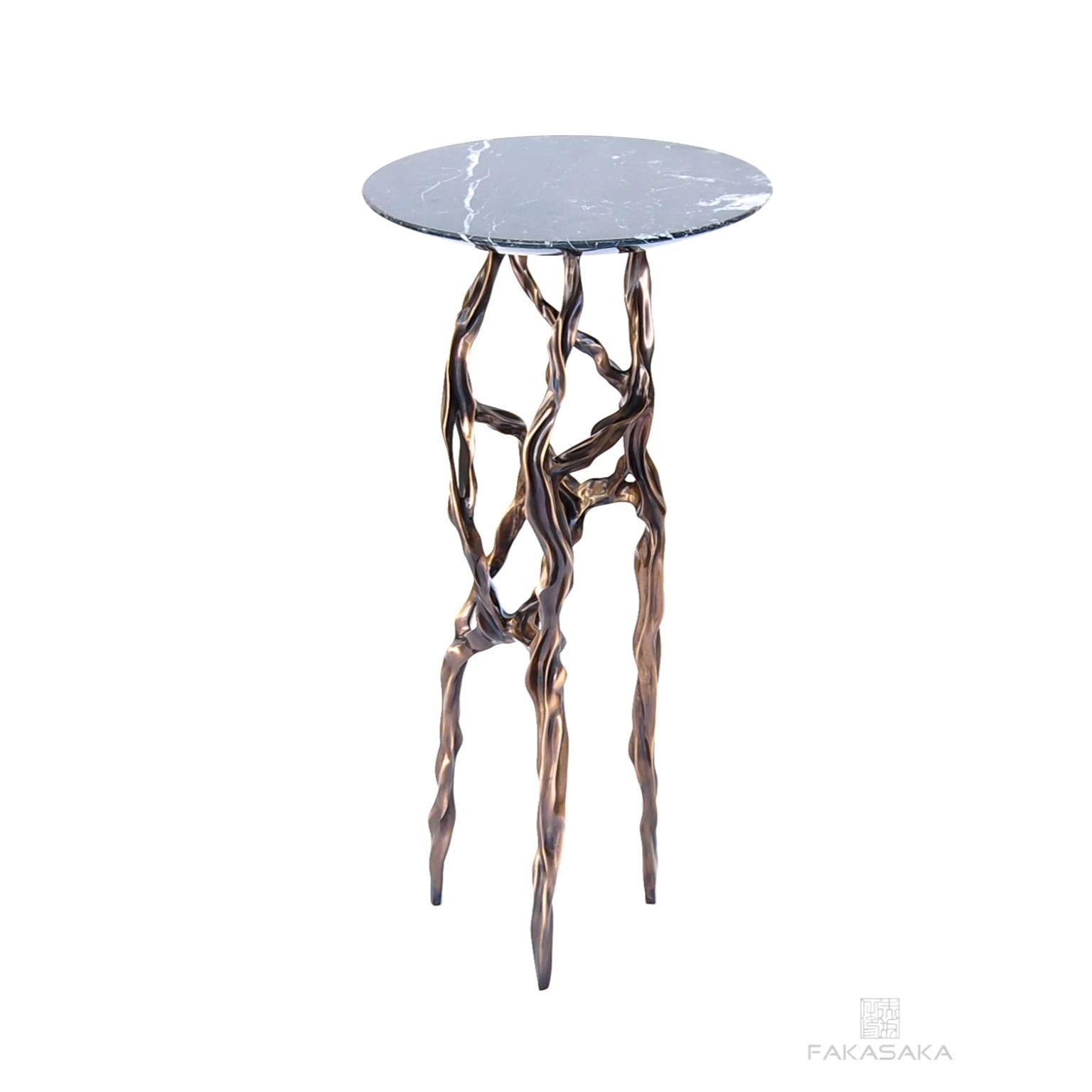 Alexia drink table with Nero Marquina Marble top by Fakasaka Design
Dimensions: W 30 cm, D 30 cm, H 62 cm.
Materials: dark bronze base, Nero Marquina marble top.
 
Also available in different table top materials (Nero Marquina Marble, Marrom