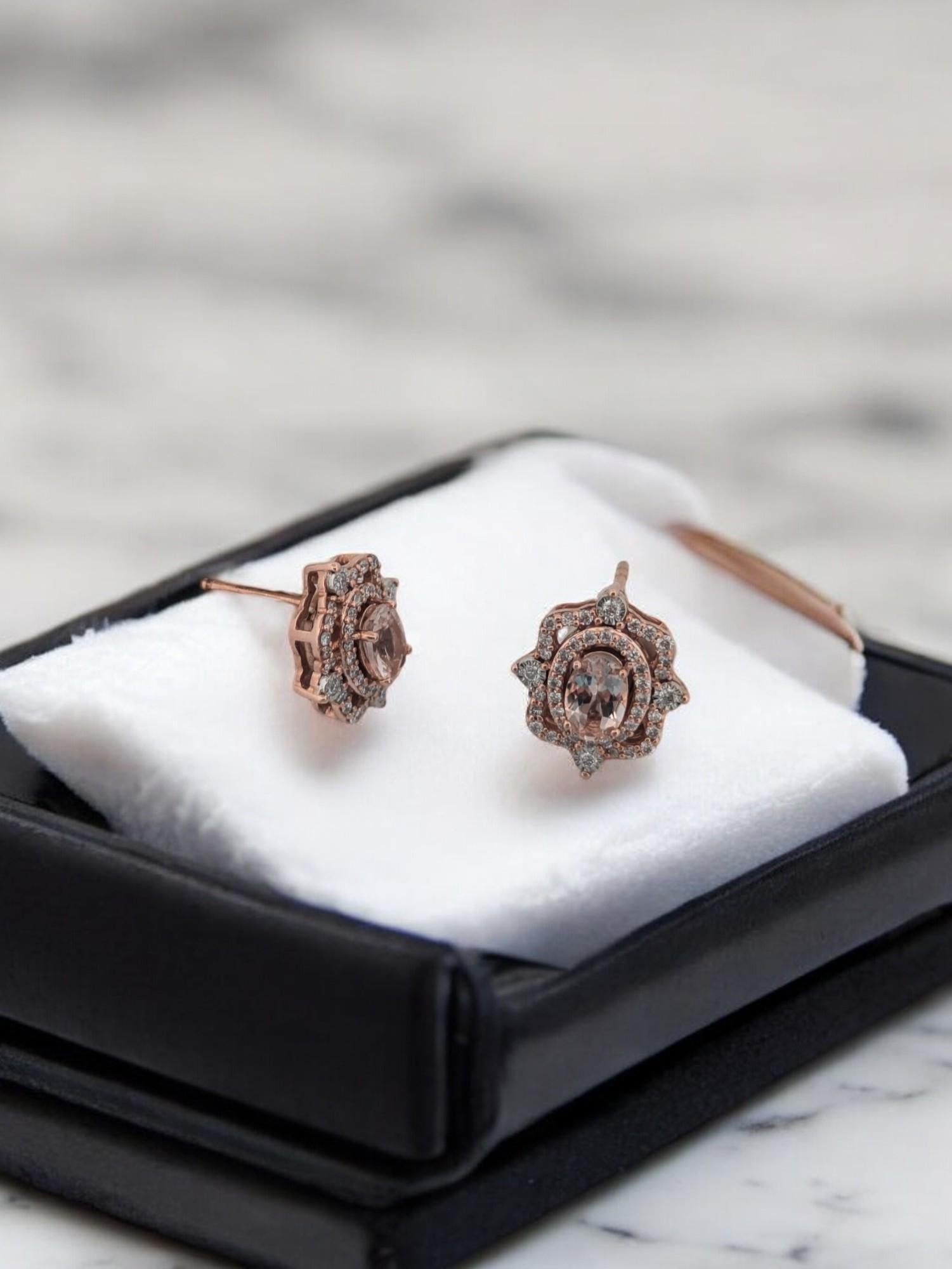 The Alexis earrings are a graceful blend of warmth and brilliance. Crafted in 14K rose gold, each stud features soft blush-pink morganite totaling 1.00ctw, surrounded by 0.39ctw of natural round diamonds. With a 13.60mm diameter, these earrings