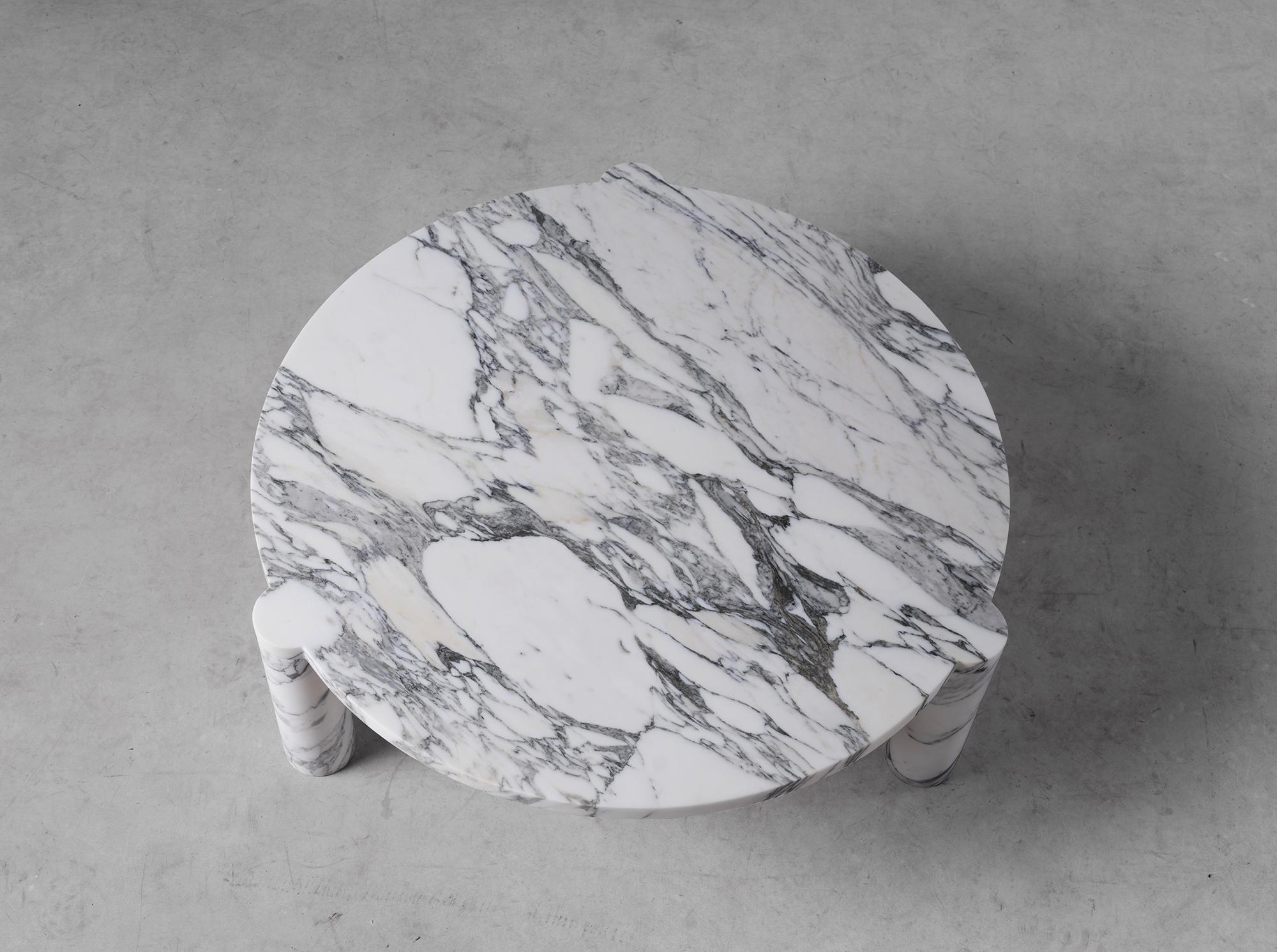 Alexis 90 coffee table by Agglomerati. 
Dimensions: W 90 x H 33 cm.
Materials: Black Marquina. Available in other stones. 

Agglomerati is a London-based studio creating distinctive stone furniture. Established in 2019 by Australian designer Sam