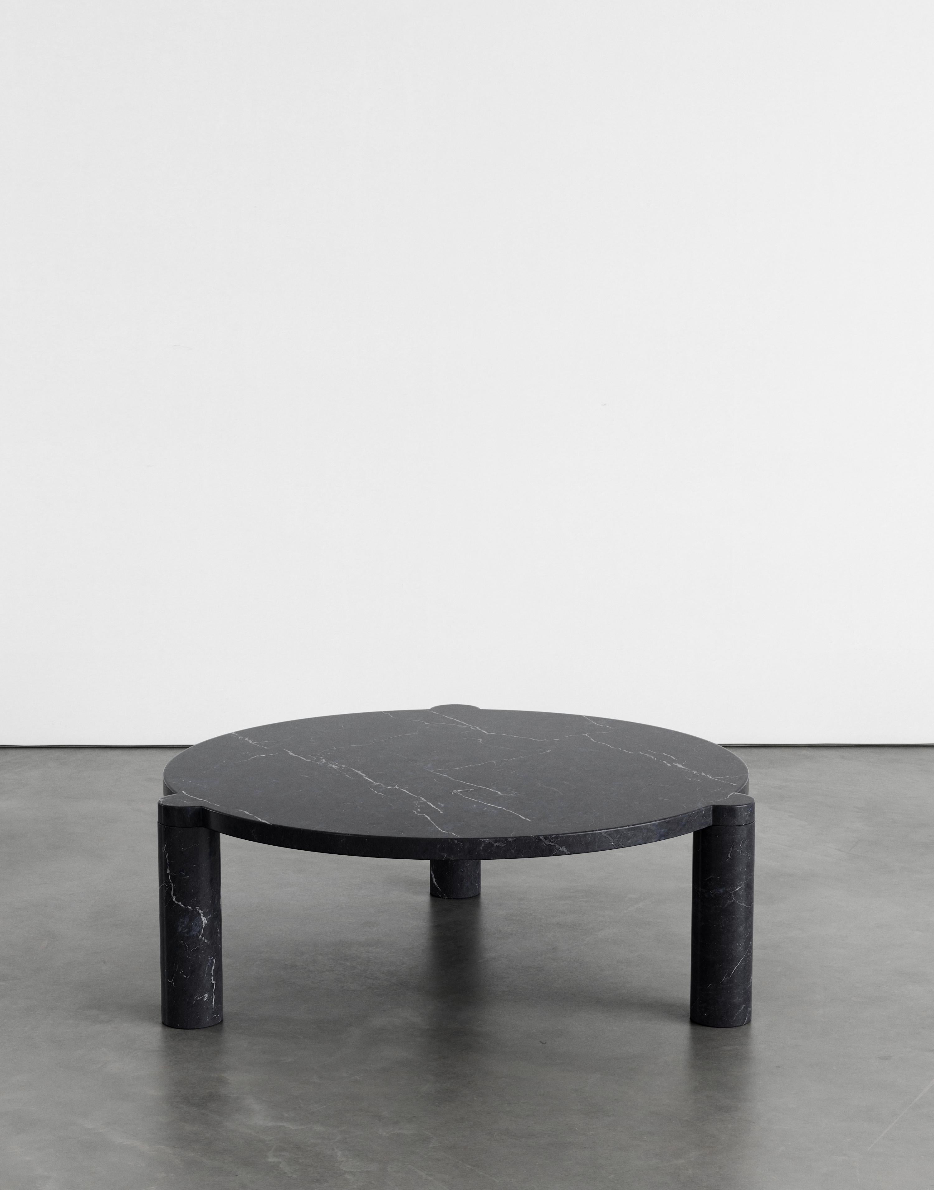 Alexis 90 coffee table by Agglomerati. 
Dimensions: W 90 x H 33 cm.
Materials: Black Marquina. Available in other stones. 

Agglomerati is a London-based studio creating distinctive stone furniture. Established in 2019 by Australian designer Sam
