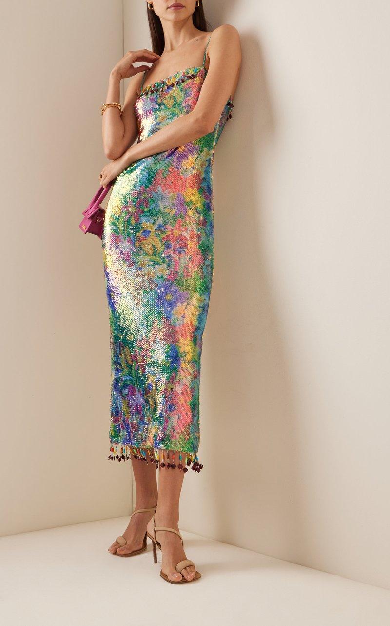This unforgettable gown skims the body with Mermaid-like sequins, making it the perfect choice for a seaside party or any spring or summer affair. The distinctive drop beading at the neckline and hem  add festive, charming flair.

Size Small,