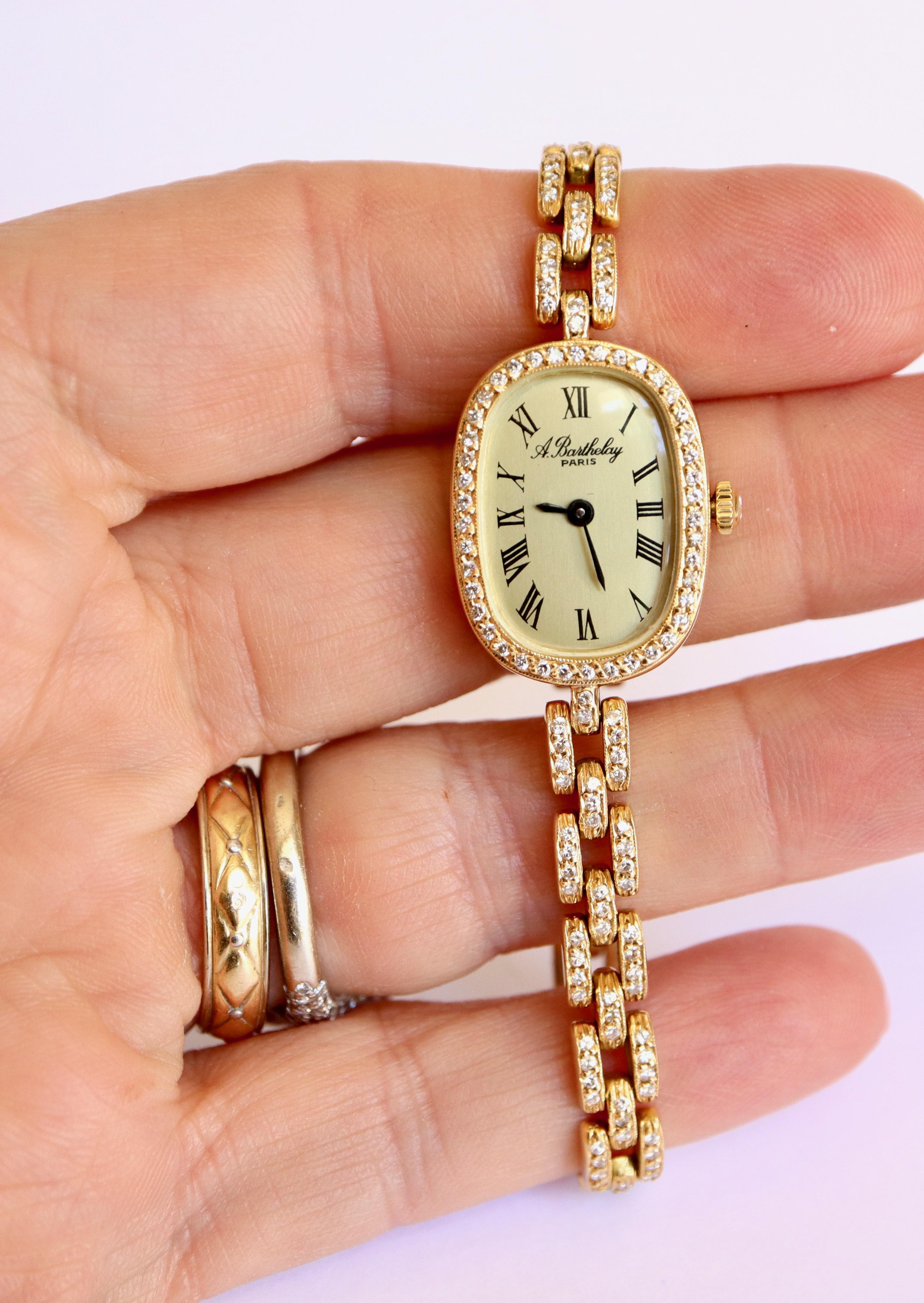 18K Yellow Gold and Diamonds Women's Wrist Watch from Alexis Barthelay.
Rare and very Beautiful Model 
Gross Weight: 33.7 g Length: 16.5 cm 
Bracelet width: 5 mm Dial: 2.3 x 1.8cm
The Bracelet and the Dial of the 18 kt Gold Watch are entirely paved