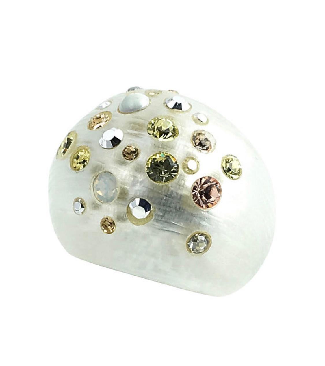 Alexis Bittar pearl-hued hand-caved Lucite bangle, clip-back earrings, and ring dusted with assorted Swarovski crystal embellishments. The bracelet has a black resin interior, hinged magnetic closure, and fits a wrist size of 7