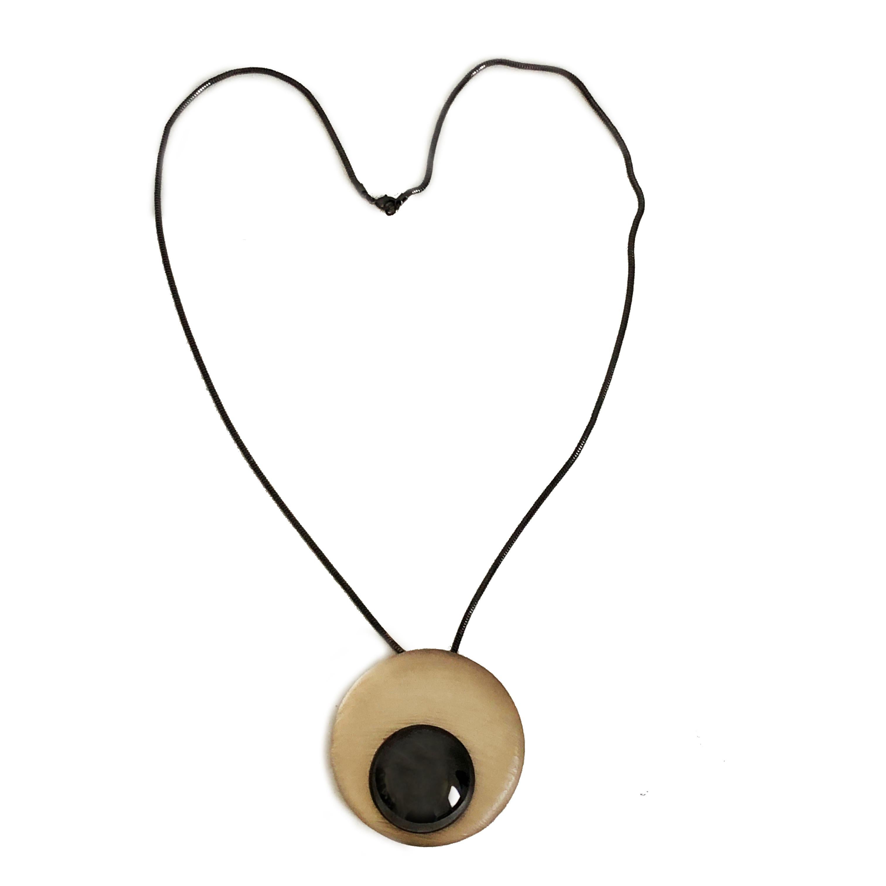 Authentic, preowned Alexis Bittar Hand Carved Modernist Orbs Pendant Necklace with Chain. Note this is one of Bittar's early pieces, likely created in the late 1990s. Gunmetal chain and small orb, textured pale yellow large orb. Preowned w/minimal
