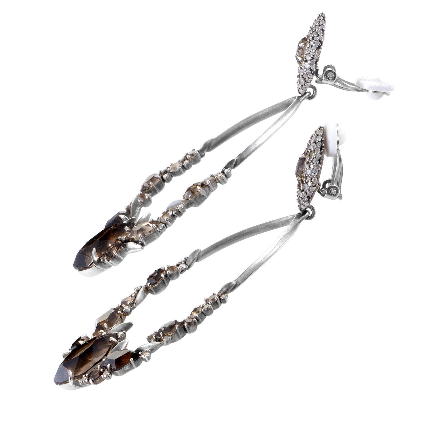 This exquisite pair of earrings from Alexis Bittar represents decadence by design. The sterling silver marquis-shaped chandeliers are beautifully clustered in smoky quartz and diamond stones with center point marquise-cut smoky quartz. The fronts of