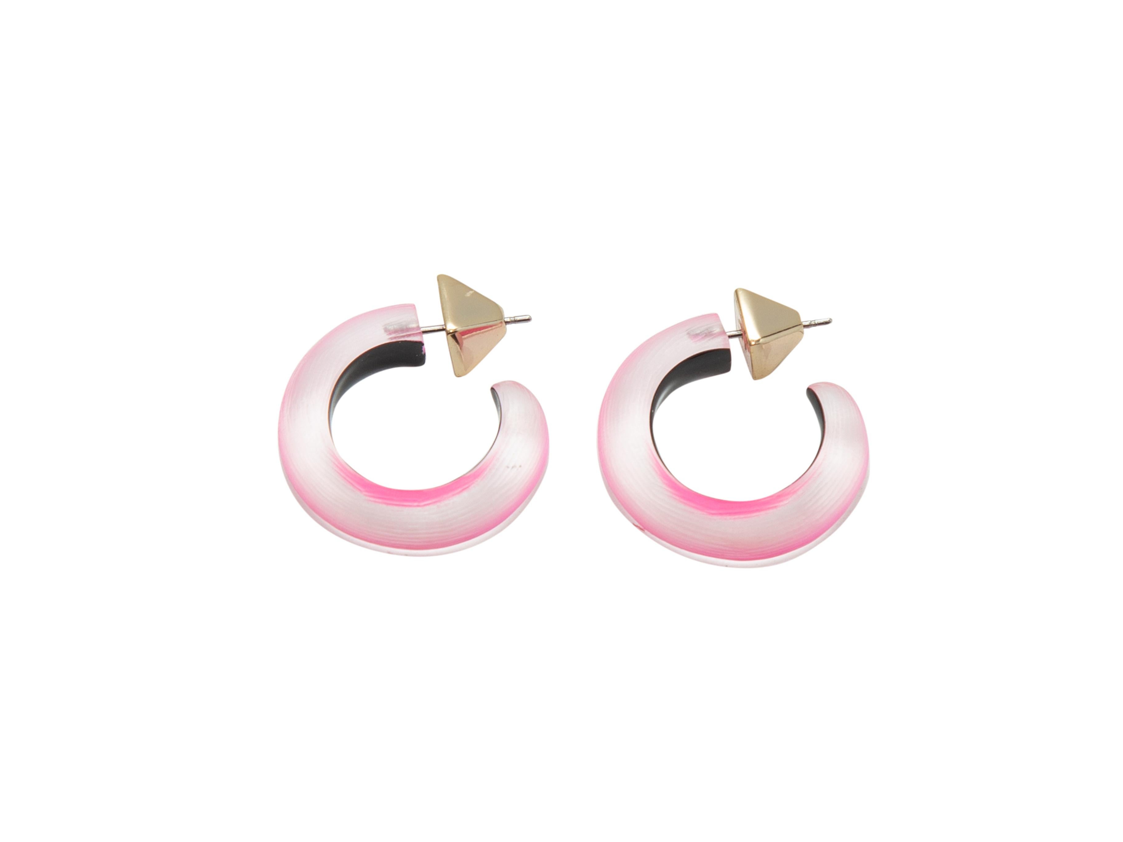 Product details: Pink lucite hoop earrings by Alexis Bittar. 0.9
