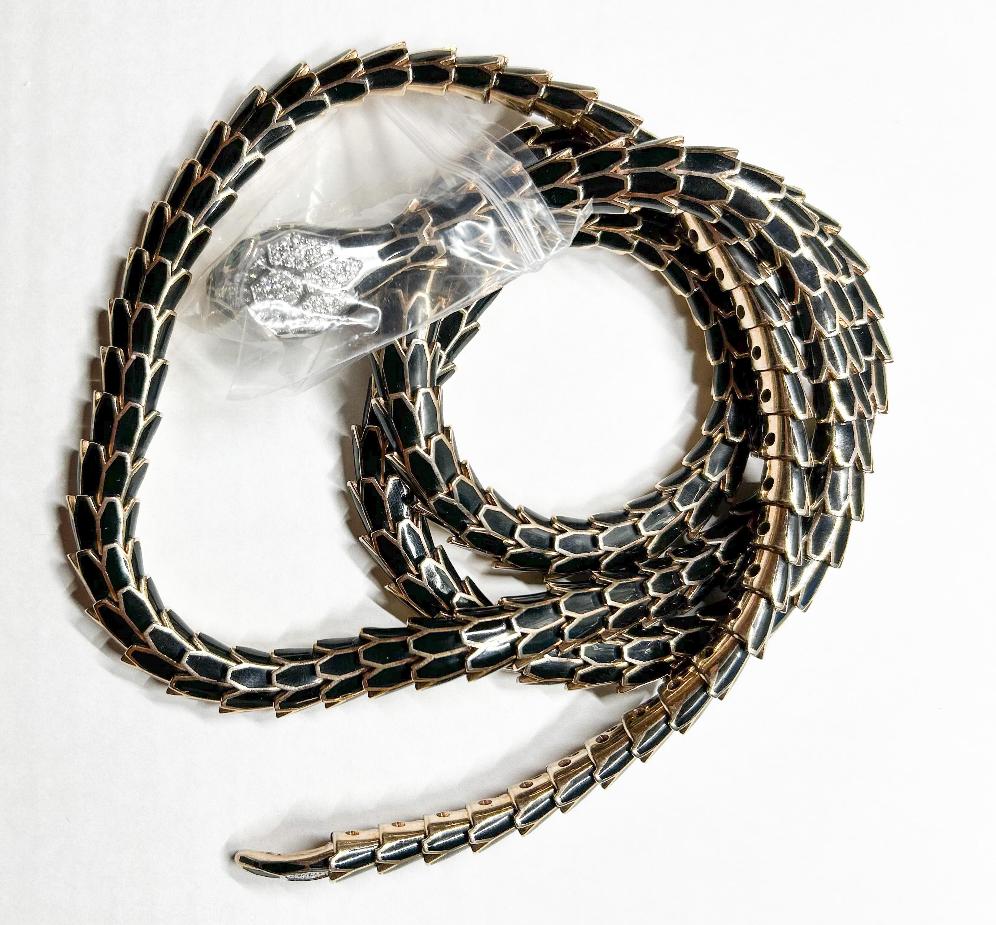 Introducing the Alexis Enamel 18K White Gold and Sterling Silver Snake Necklace Belt, a stunning and enigmatic jewelry piece that combines striking design with precious gemstones to create a unique and captivating accessory. 

This snake