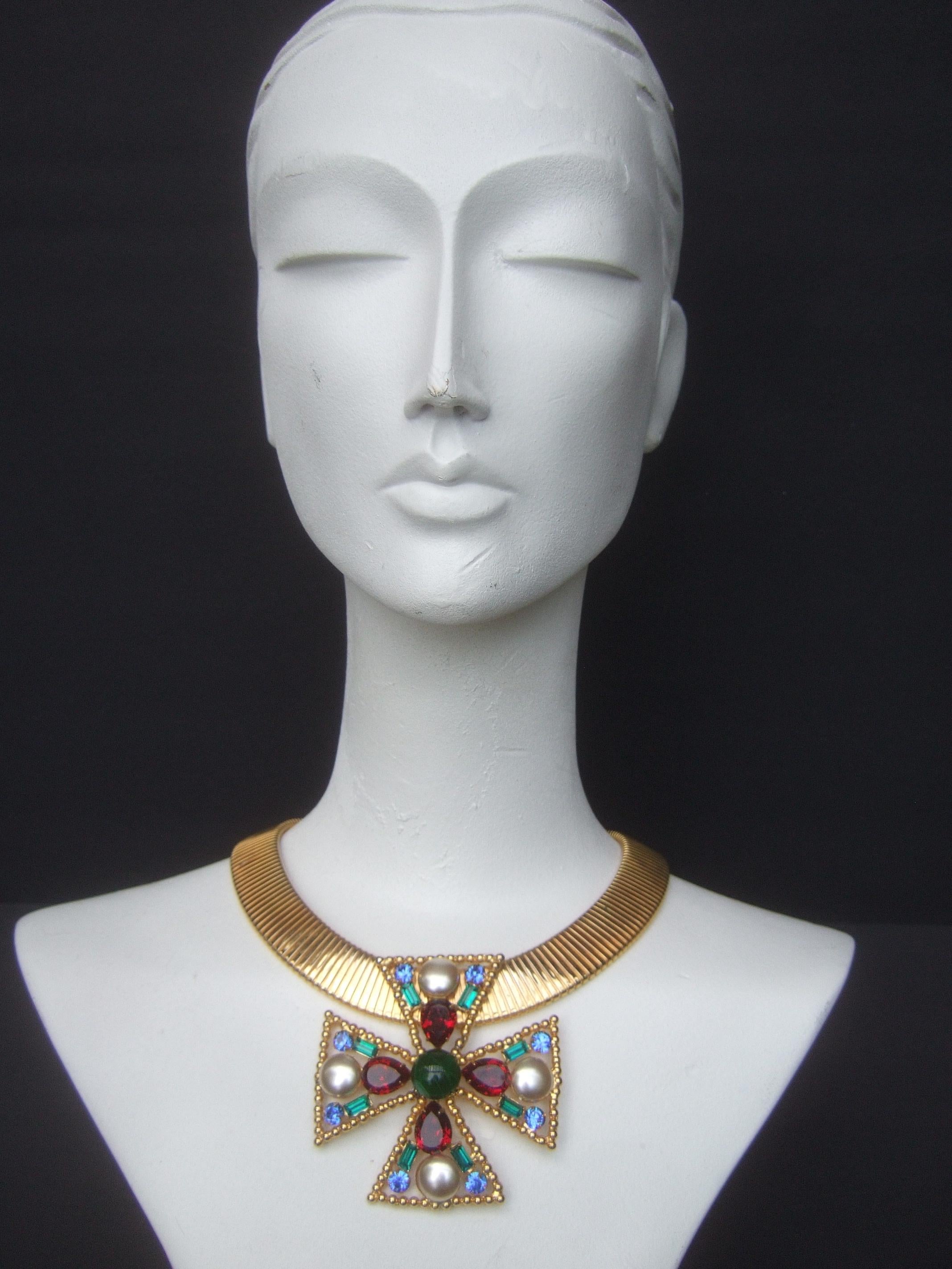 Alexis Kirk Massive glass jeweled maltese cross choker necklace
The wide gilt metal stretch choker is adorned with a large scale 
maltese cross glass stone stationary pendant

Makes a very dramatic eyecatching necklace
Designed by Alexis Kirk