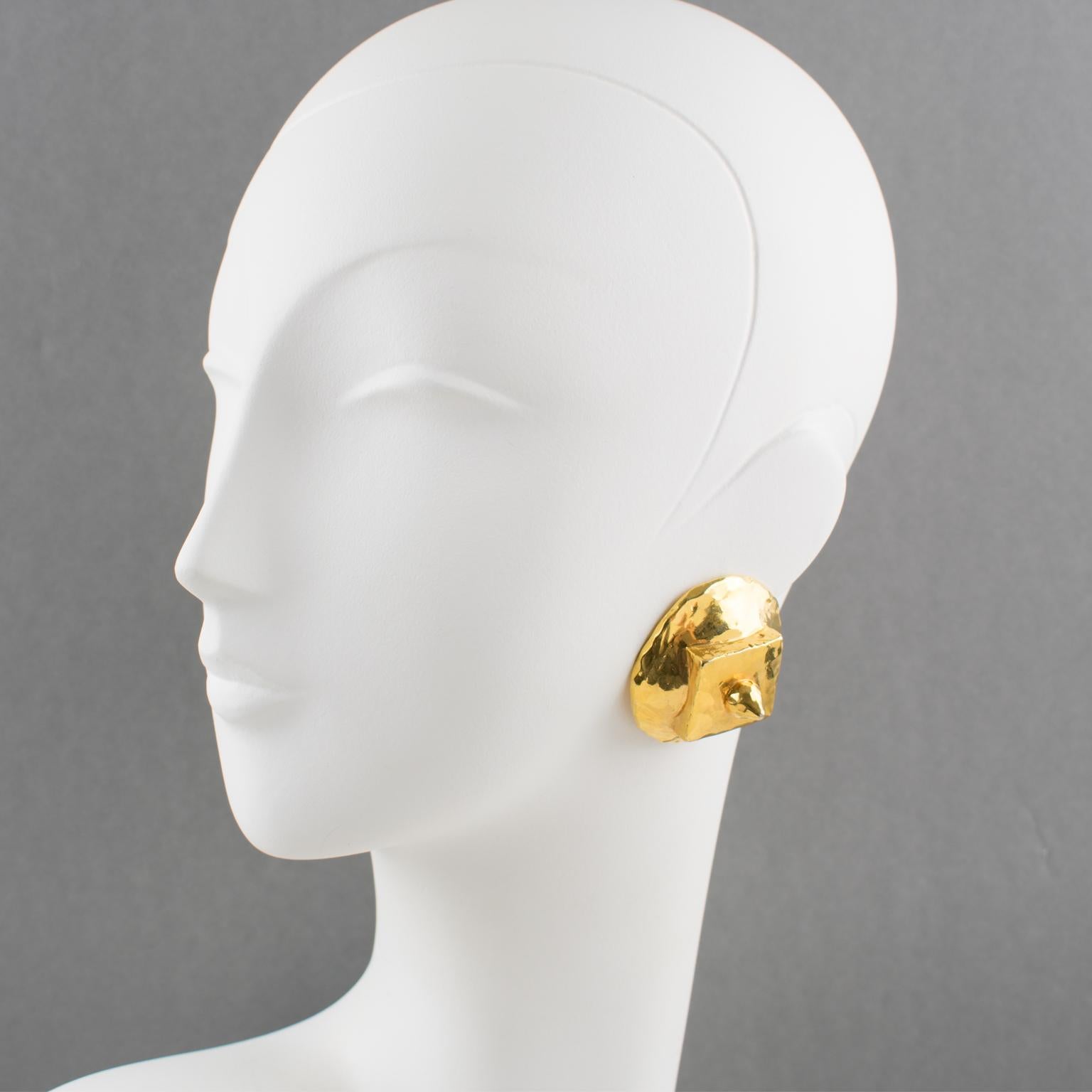 Stunning French designer Alexis Lahellec Paris signed clip-on earrings. Unusual futurist pieces featuring a large rounded and domed shape with geometric structure in gilt coated resin all textured with a hand-made feel. Signed underside: 'Alexis