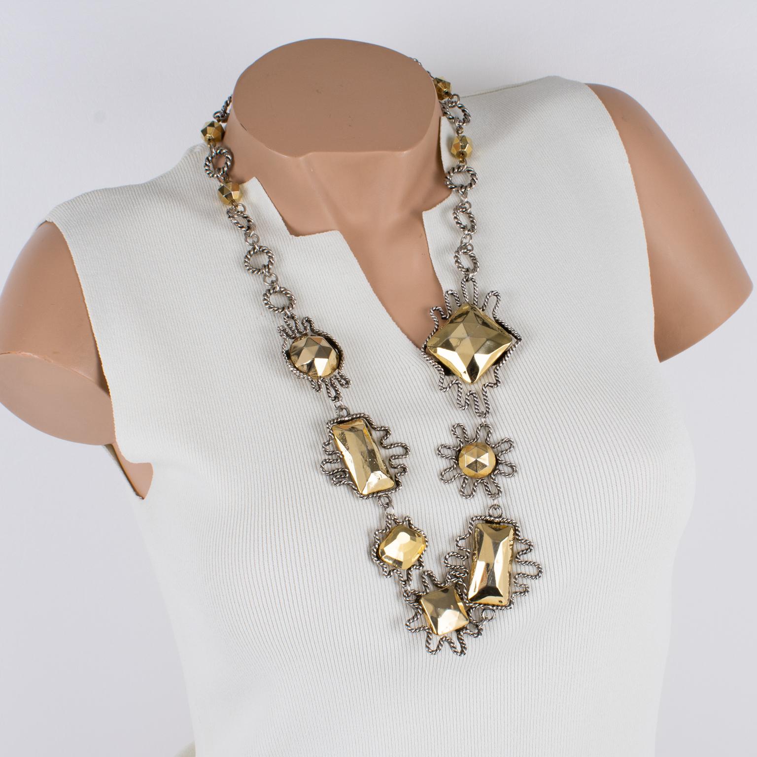 French jewelry maker Alexis Lahellec designed this stunning charm necklace in the 1980s. This piece features a silver plate rope chain ornate with charm medallions. Each medallion has a different shape, framed by a silver plate and topped with gilt