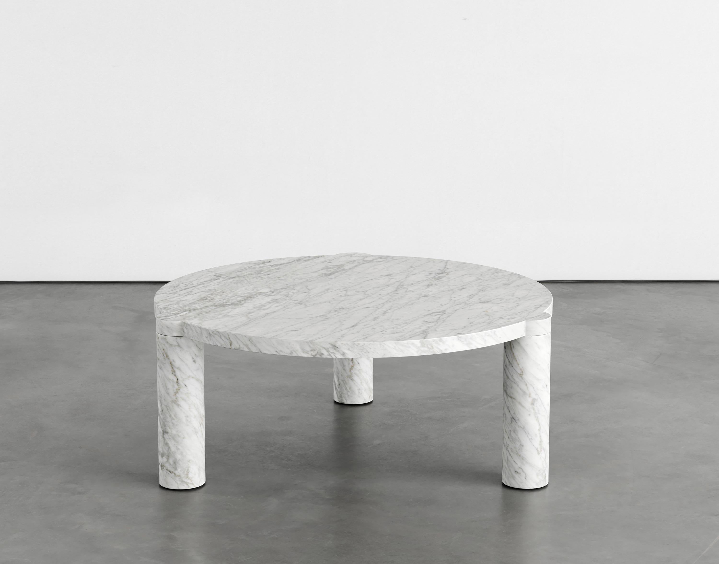 Alexis marble coffee table by Agglomerati
Dimensions: D 80 x H 33 cm.
Materials: Carrara Gioia marble.
Available in other stones.

Alexis Coffee Table has off-set, cylindrical legs that curve flush underneath the tabletop, providing a soft