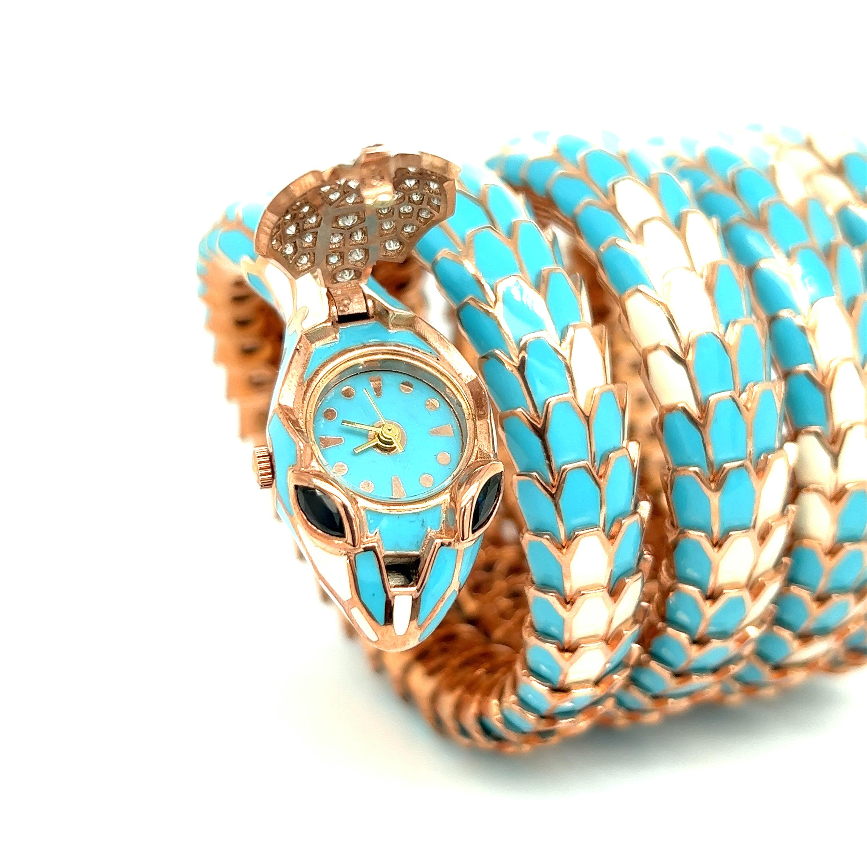 Alexis NY Light Blue & White Enamel Five Row Watch Wrap Bracelet

The body is made of sterling silver with a rose gold tone, the head and tail are made of 18 karat white gold; the white gold is set with round cut diamonds weighing 1.10 carats; the