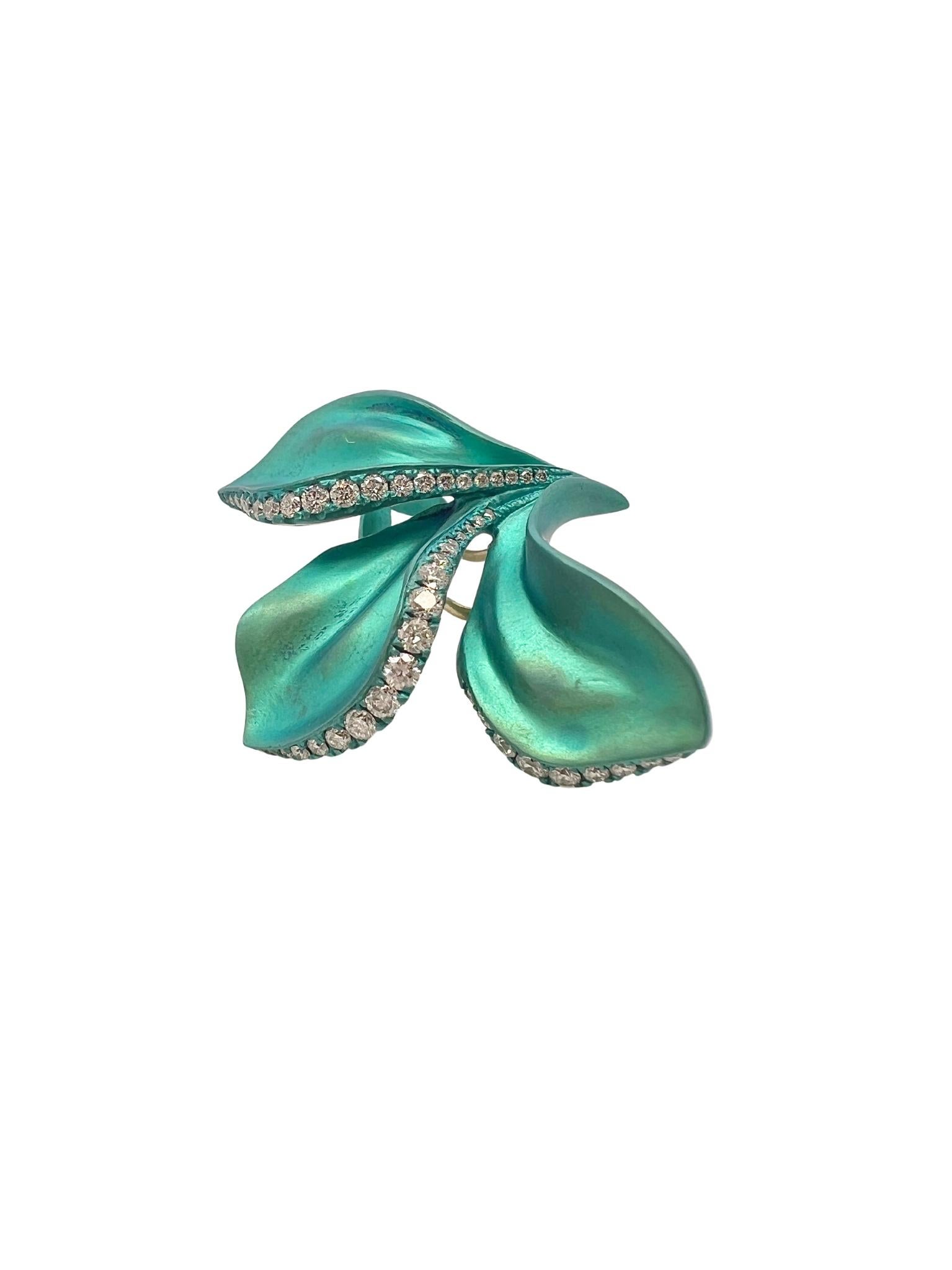 Alexis NY Pair of Diamond and Titanium Clip-on Earrings 

Details:
Fashioned as teal green leaves, set with round diamonds weighting approx. 1.10 carats, in titanium.
Weight of the pair: 10.0 grams
Fitted with clips and posts.
Length: 1 1/2 inches