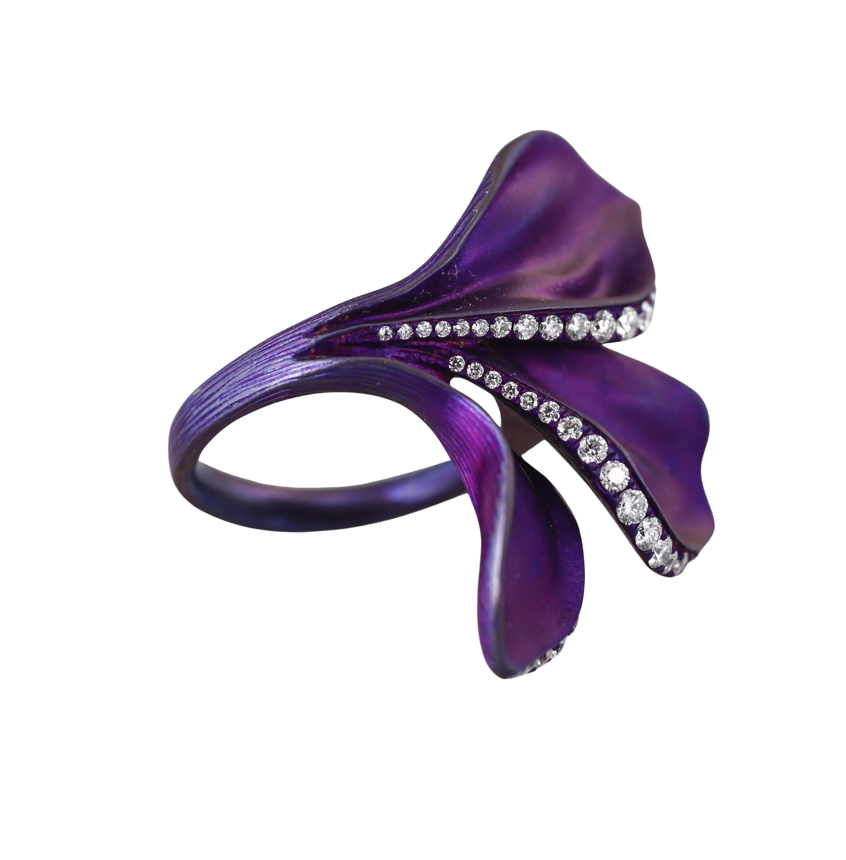 Purple titanium three leaves ring by Alexis NY, with 0.56ctw H?VS diamonds. 
Ring size 6, top is 35mm x 28mm.
Marked with an Alexis snake hallmark, Ti, 0.56ct, 052475.
Weight - 5.4 grams. 

Excellent condition