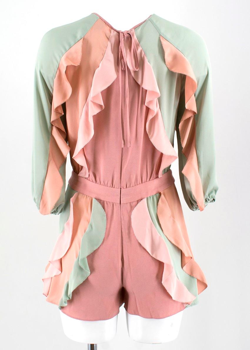 Alexis Pastel Ruffled Playsuit

- Long sleeve playsuit
- Ruffles in a variety of pastel tones
- Zip closure on the back with a bow 

Please note, these items are pre-owned and may show signs of being stored even when unworn and unused. This is