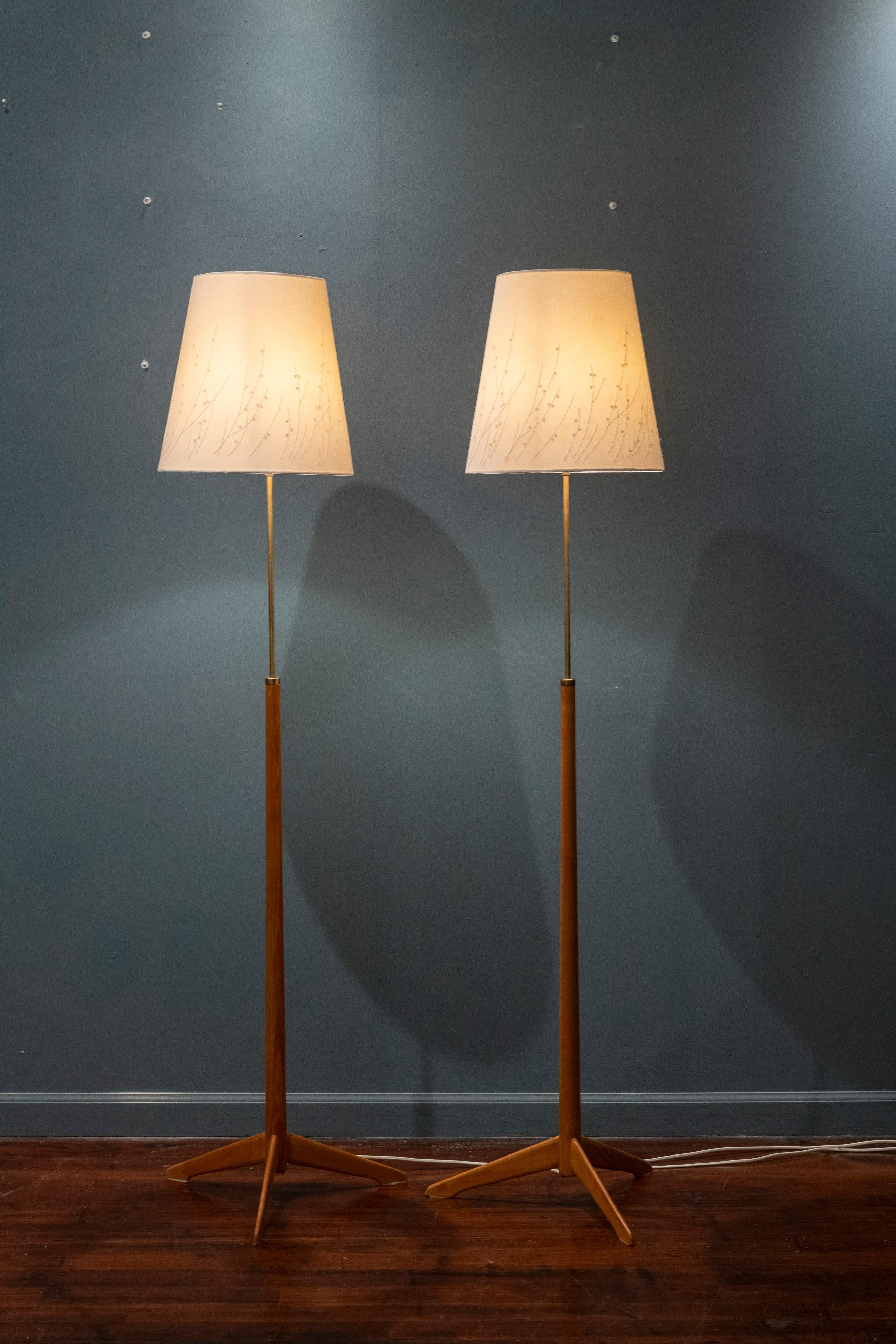 Scandinavian Modern floor lamps by Alf Svensson for Berboms, Model G-34 Sweden. Simple modern design floor lamps made from oak and brass that are light and elegant. Embroidered shades are included in good used condition that present very well. Lamps