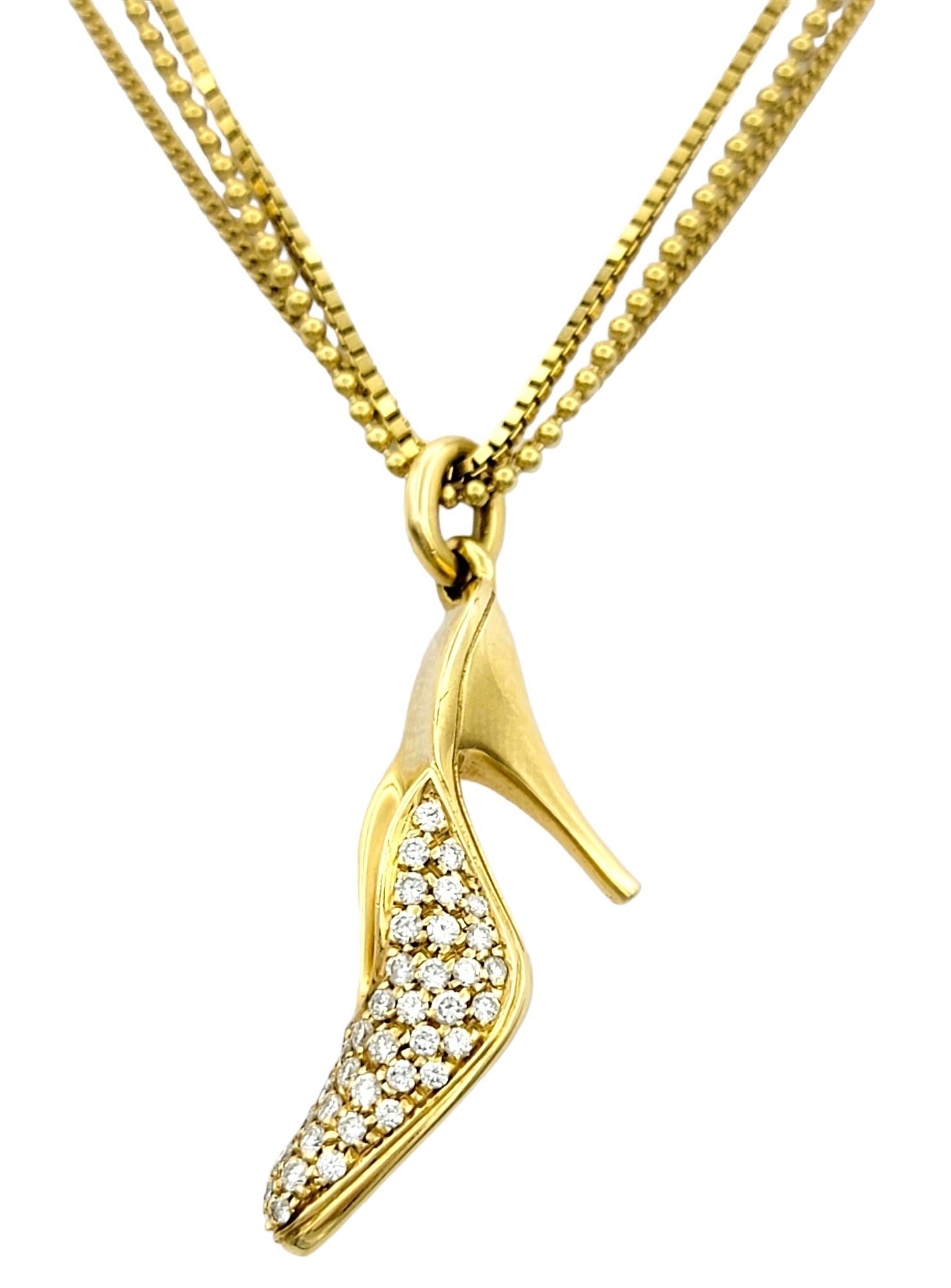 This playful 18 karat yellow gold pendant necklace is a dazzling embodiment of style, sophistication, and innovation, created by Alfieri & St. John. 

The pendant itself takes the form of an iconic stiletto high heel, a symbol of elegance and
