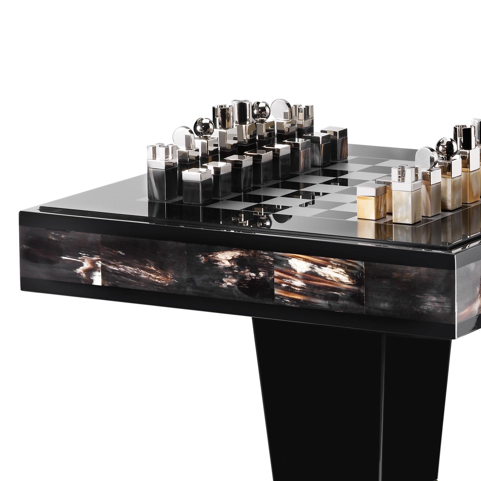 An evident example of superior craftsmanship, the Alfio chess table is destined to become a family heirloom. Boasting an elegant top in tempered smoked glass with silkscreened silver chessboard, it offers a unique playing surface sitting on an