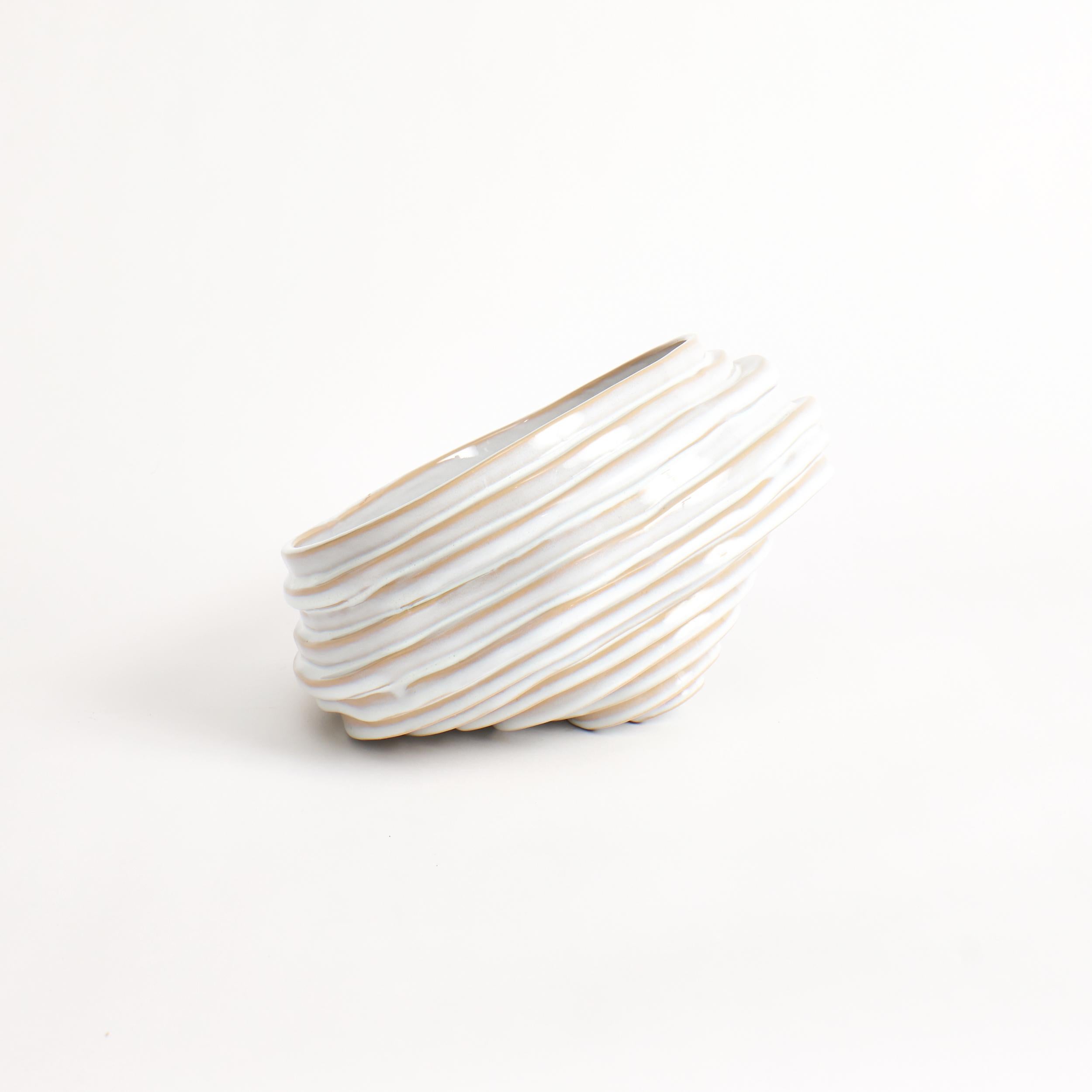Alfonso Fruit Bowl in Shiny White

Designed by Project 213A in 2021

Handmade Stoneware

This tilting designed piece is part of the Alfonso range, sculpted by organically displacing several individual layers. This shiny white glaze appears in some