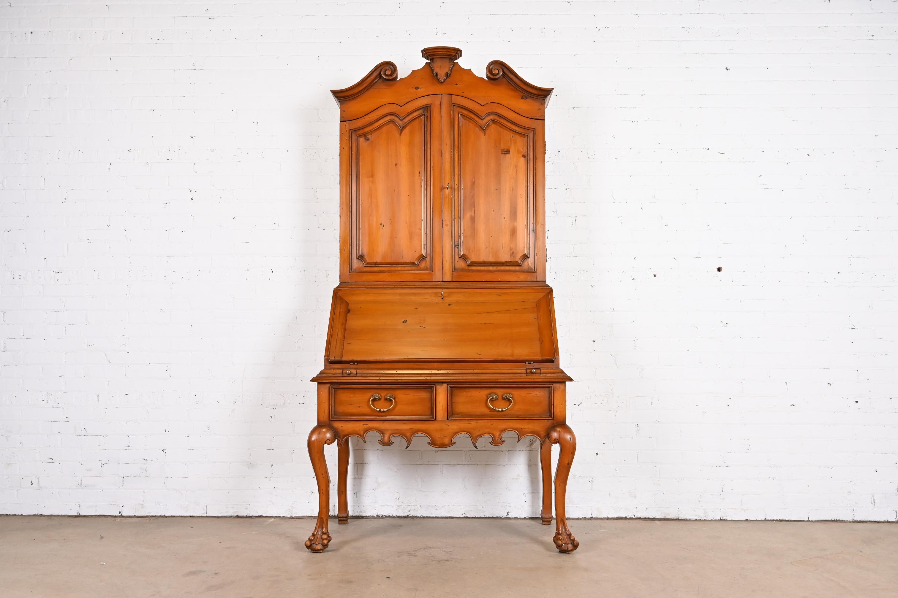 A beautiful Georgian or Chippendale style bureau with drop front secretary desk and bookcase hutch top

By Alfonso Marina

Mexico, 1998

Gorgeous carved pine, with original brass hardware.

Measures: 44.5