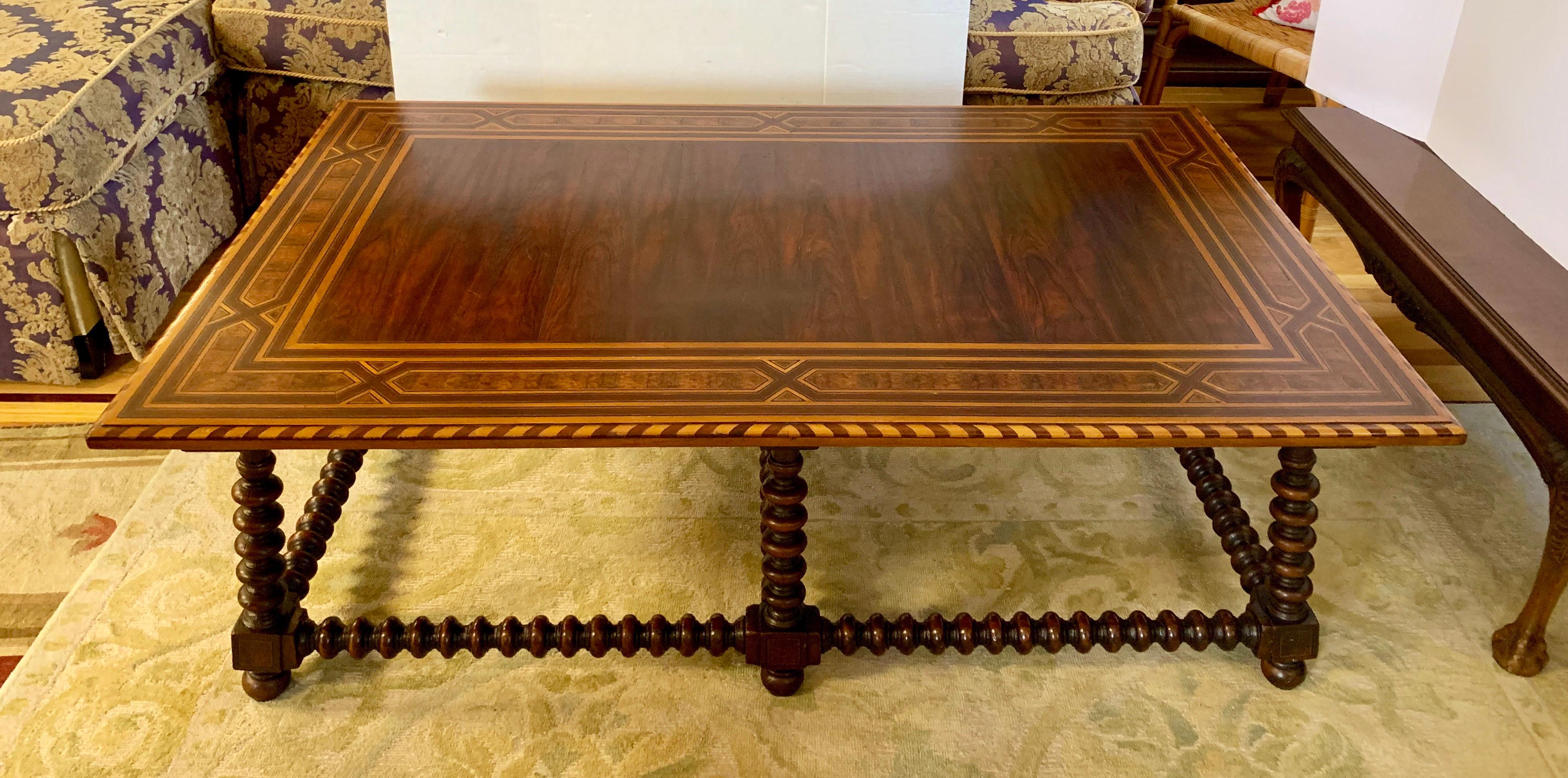Finely handcrafted and masterfully inlaid large coffee table by Alfonso Marina of Mexico. It features perfectly executed inlaid wood patterns and barley twist legs and stretchers.
