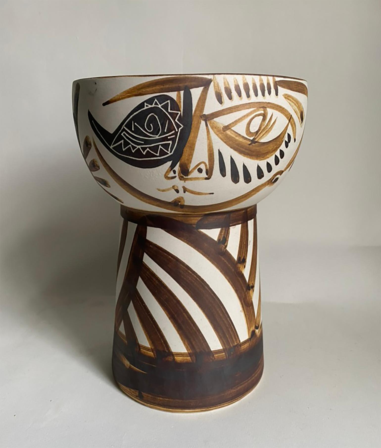 Here is a very striking ceramic vase by Alfonso Otero Regal. The Picasso-style vase was crafted in Galicia, Spain and features a face design with other hand-painted and etched sgraffito abstract motifs. The vase is fairly substantial, measuring 7