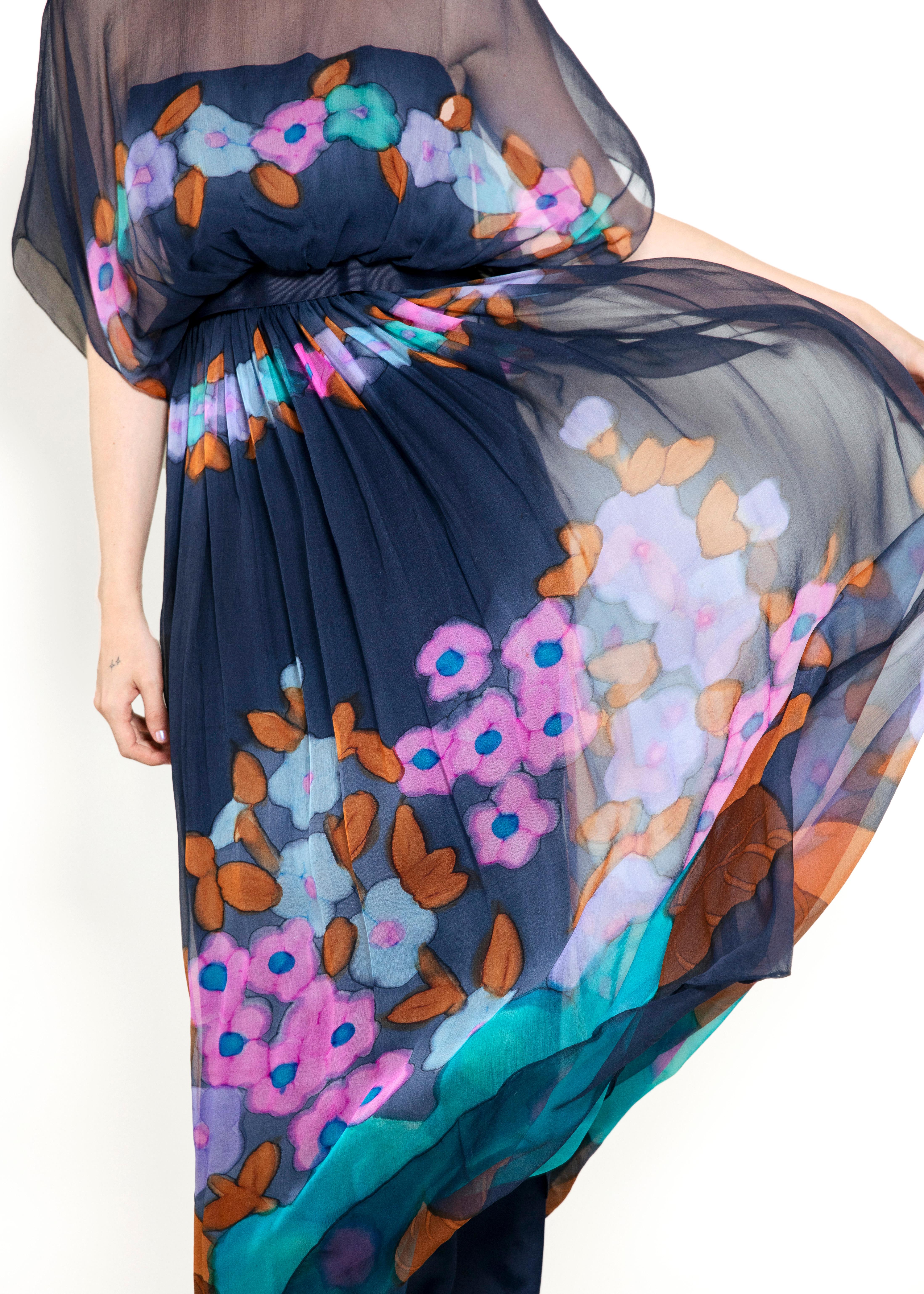Elevate your wardrobe with this Alfred Bosand Silk Floral Print Maxi Dress. Featuring an elegant floral print and ribbon waist, it is perfect for any occasion. Fully lined and versatile, this dress is sure to become a wardrobe favorite.

