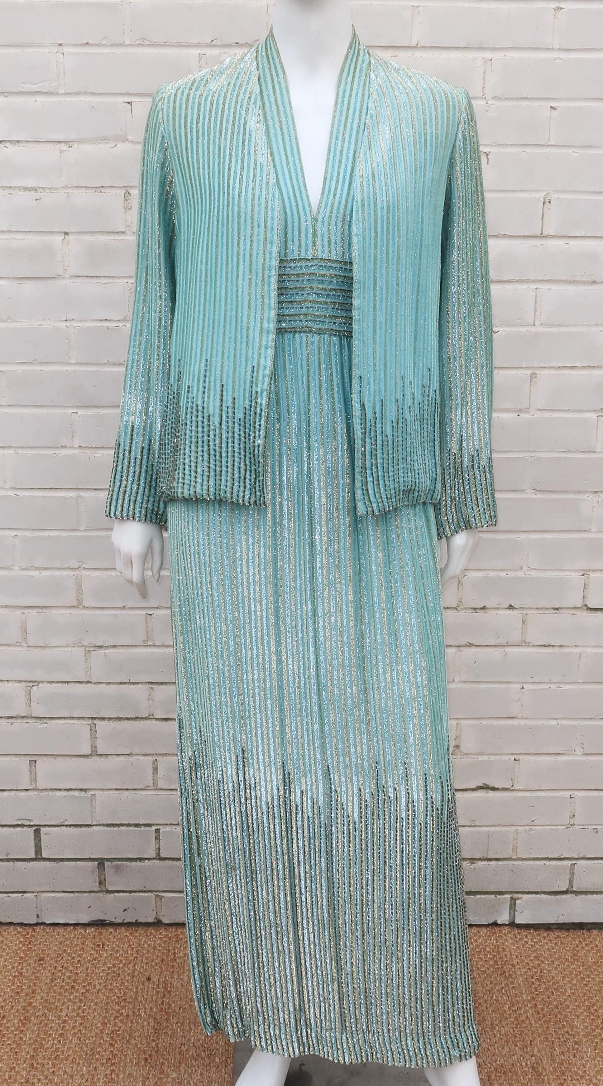 Va-va-voom! Ultra glamorous 1970's two piece halter dress and jacket by New York couturier, Alfred Bosand.  The two pieces are designed with a unique mint green fabric that has a velvety gold lamé stripe akin to a flocked fabric with gold bugle
