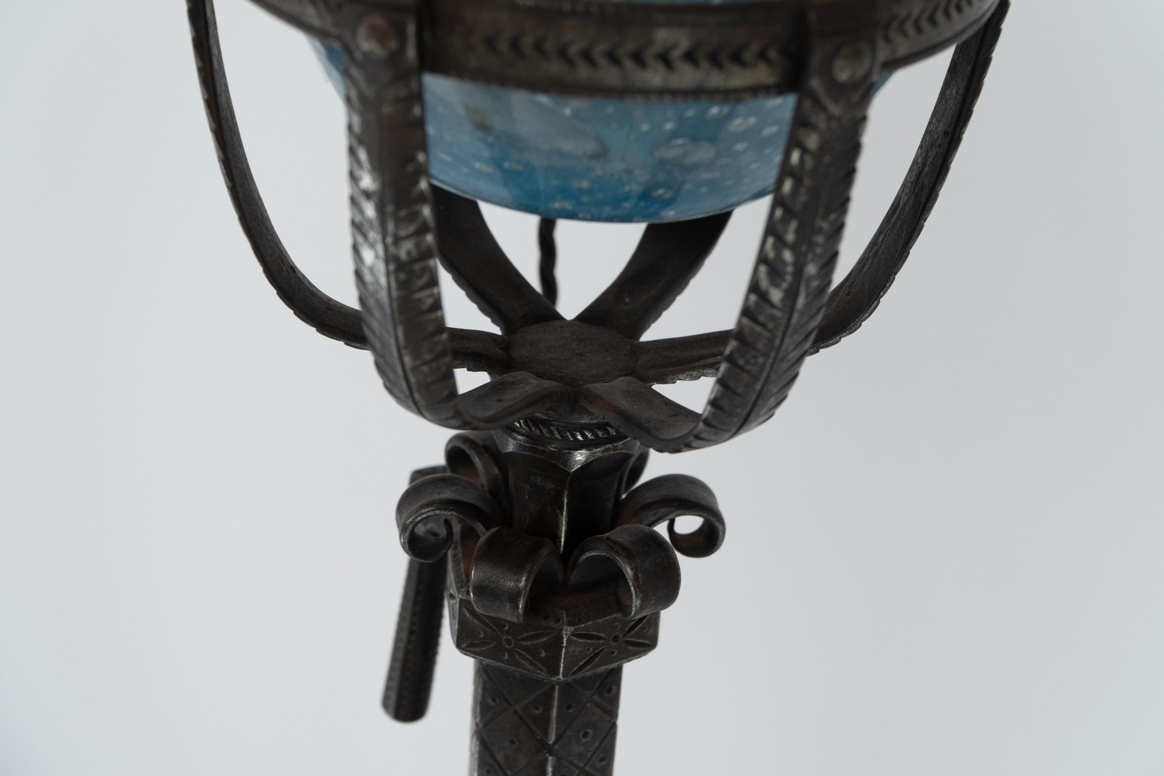 Early 20th Century Alfred Bucknell. A handmade steel standard lamp with finely chased details. For Sale