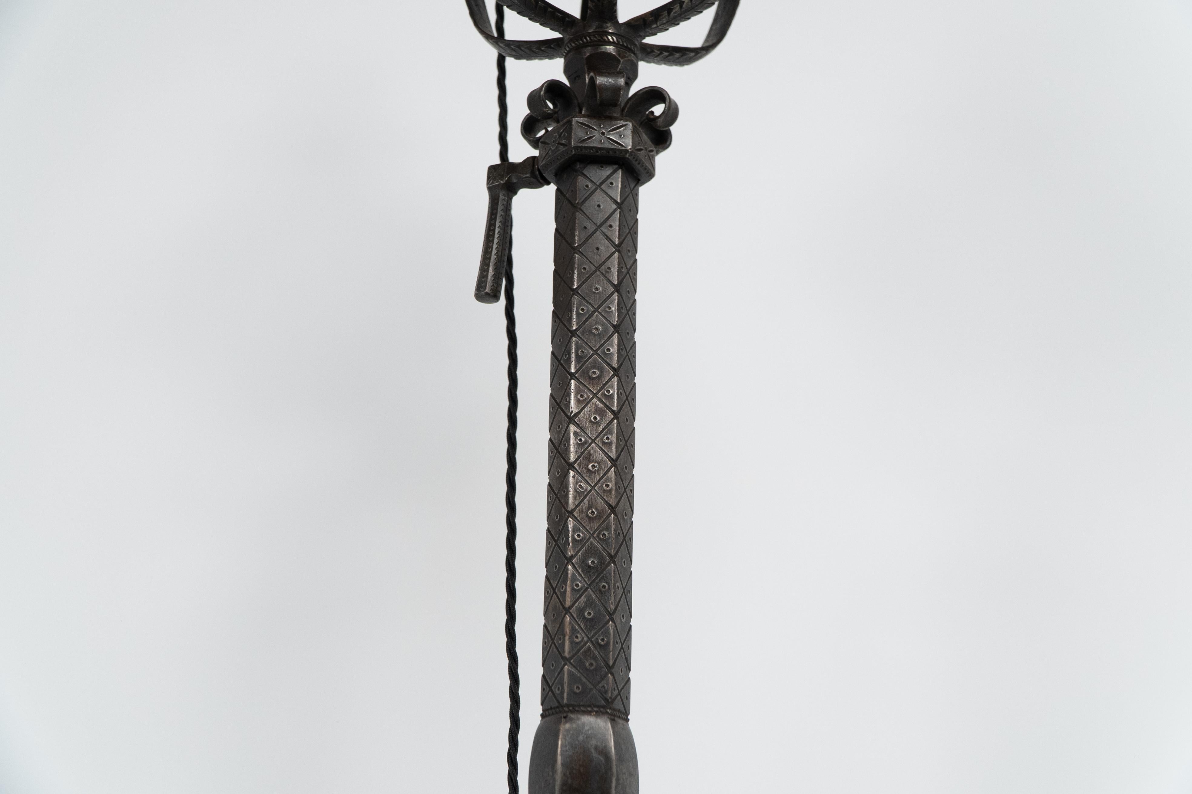 Alfred Bucknell. A handmade steel standard lamp with finely chased details. For Sale 1