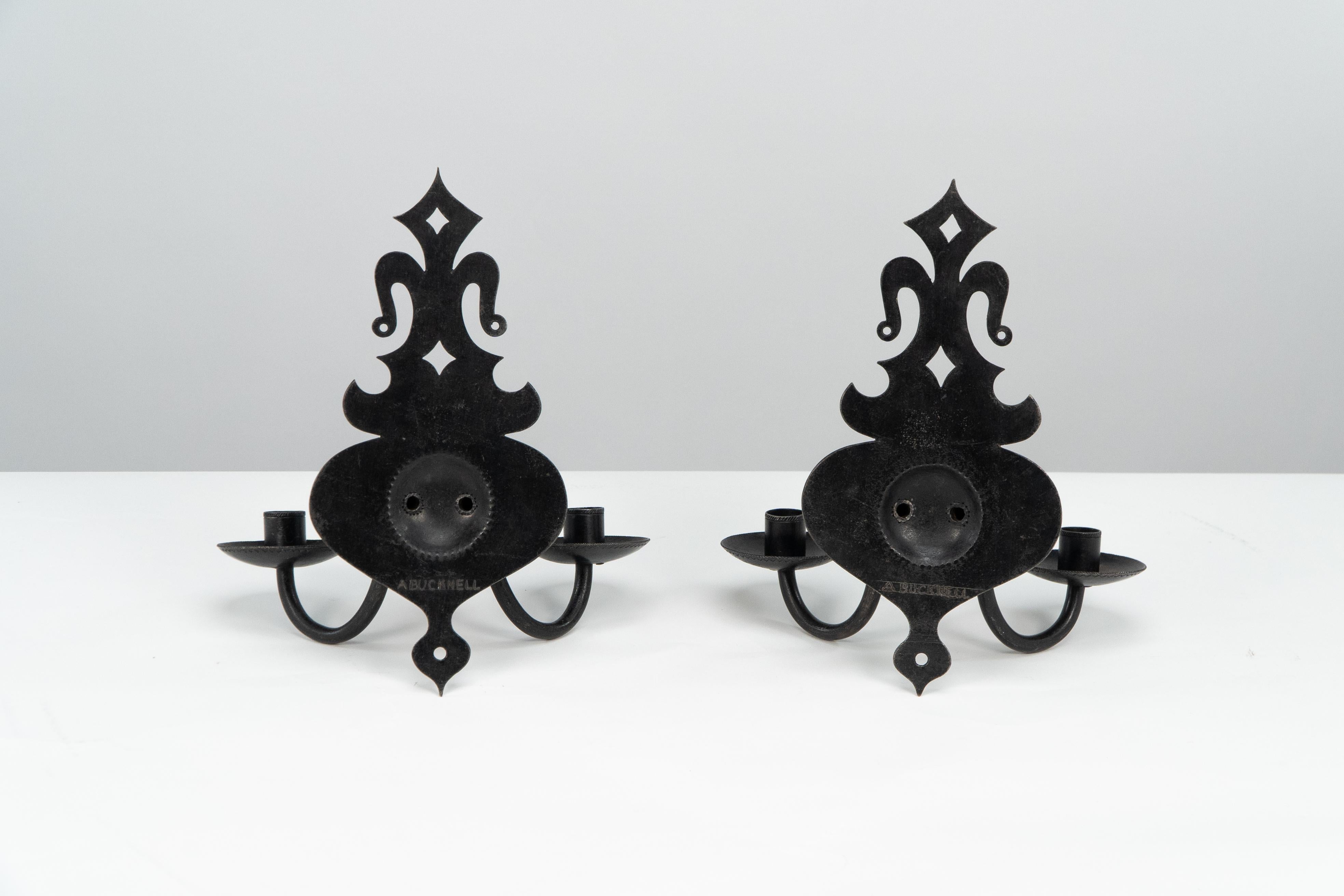 English Alfred Bucknell. A rare pair of Arts & Crafts museum quality steel wall sconces. For Sale