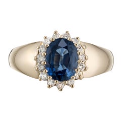 Alfred Butler Anillo de compromiso de oro con halo de diamantes y zafiro oval de 2,00 quilates