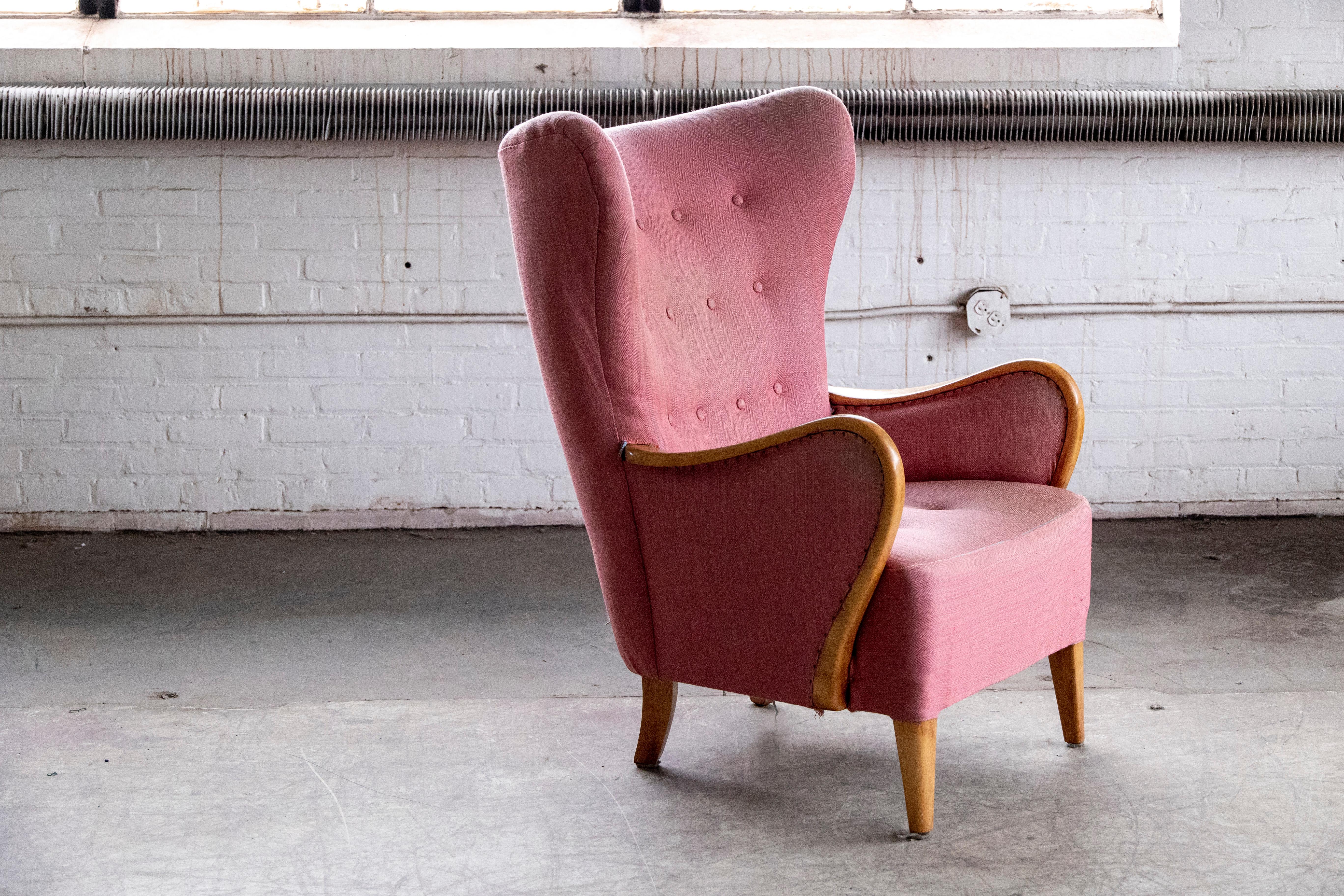 Classic elegant Danish high back armchair from the 1940s by Alfred Christensen for Slagelse Mobelvaerk with closed armrests in beautifully curved elmwood. Nice slim elegant silhouette and very organic design lines. Supportive and comfortable. Solid