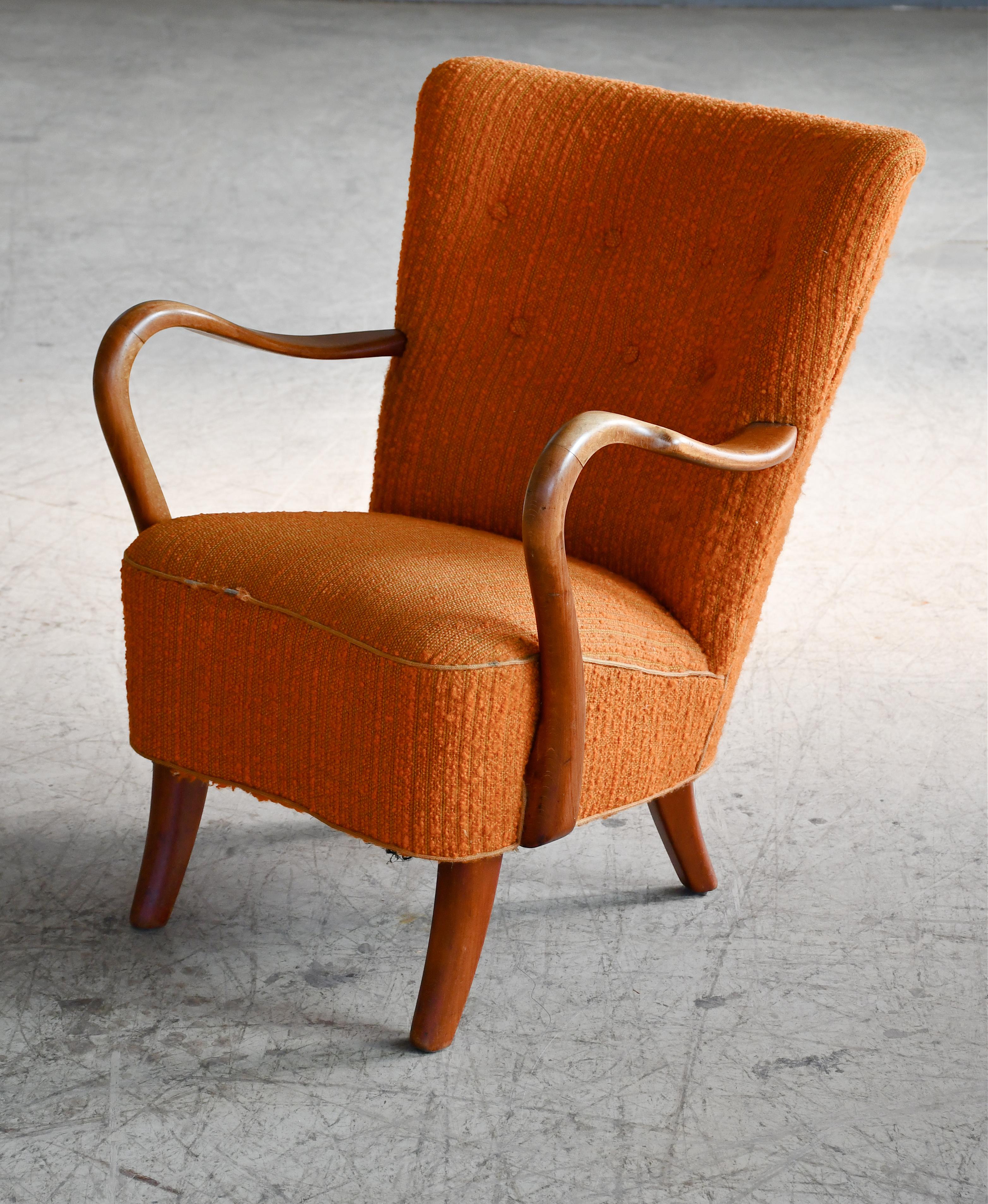 Classic elegant Danish low back lounge chair from 1940s by Alfred Christensen for Slagelse Mobelvaerk with open armrests in beautifully curved stained beech. Nice slim elegant silhouette. Solid and sturdy construction. The fabric was added at a