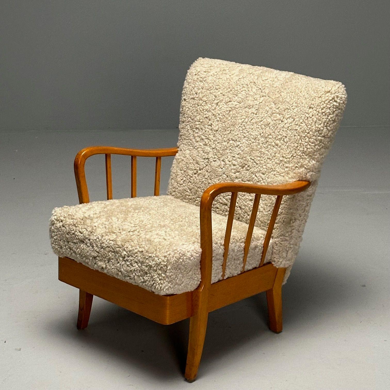 Alfred Christensen Style, Swedish Mid-Century Modern Arm Chair, Shearling, Beech
 
Lounge chair designed and produced in Denmark circa 1950s. The backrest and the seat are upholstered in light beige, genuine curly shearling upholstery. The frame is